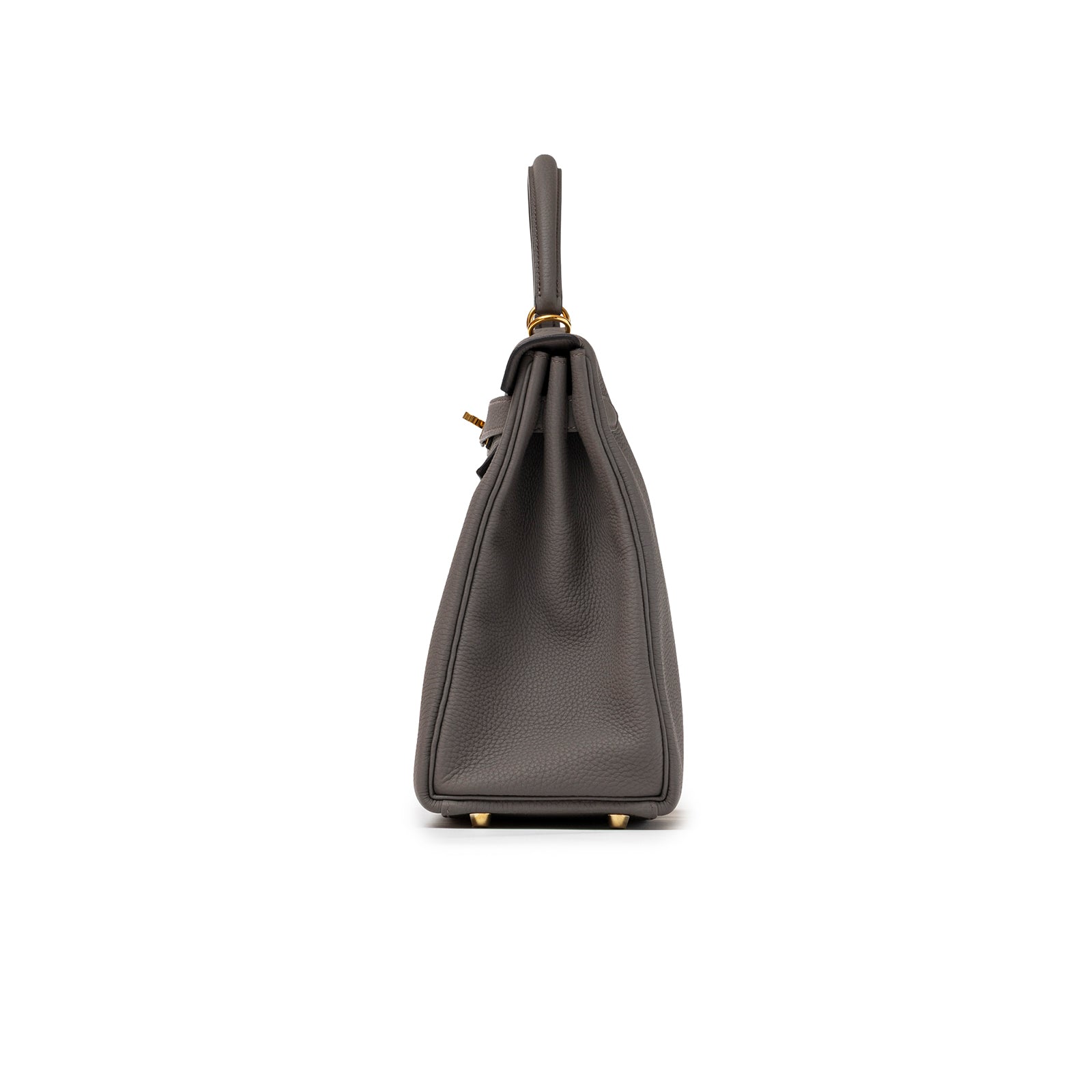 Side profile of Hermès Kelly 32 Retourne Etain Togo Gold Hardware highlighting its structured silhouette and leather texture.