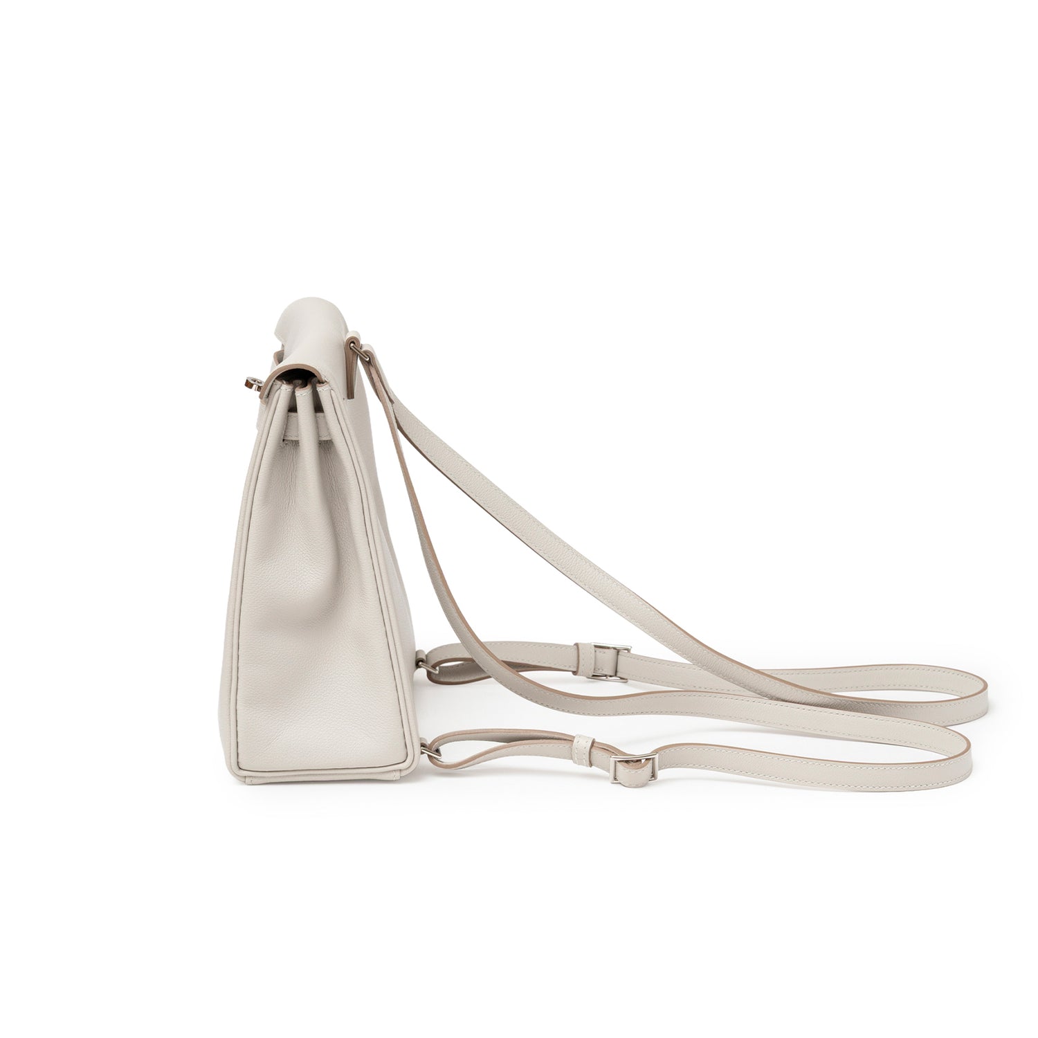 Side profile of Hermès Kelly Ado Backpack Gris Perle Evercolor Palladium Hardware with adjustable straps and smooth leather sides