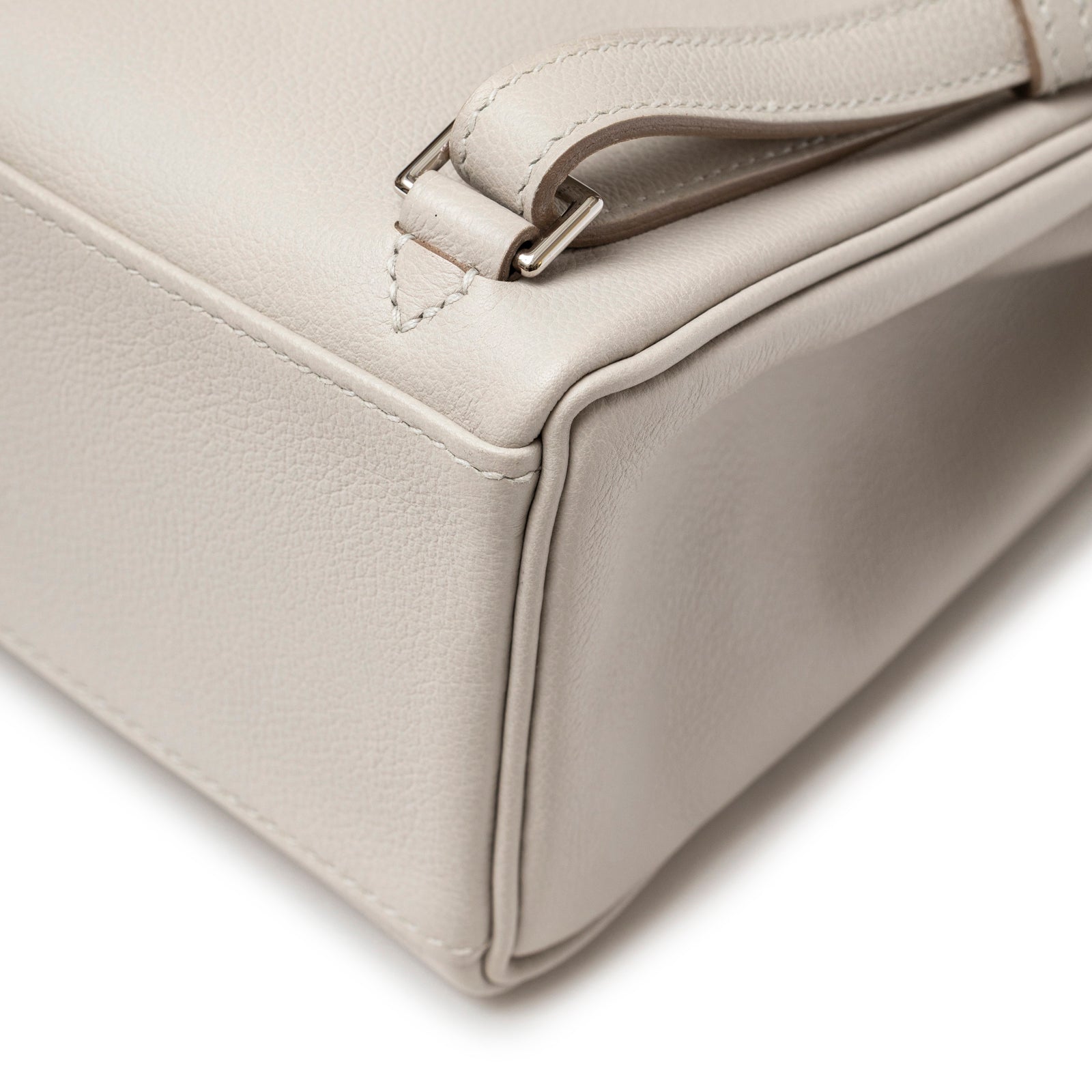 Close-up of corner and strap attachment on Hermès Kelly Ado Backpack Gris Perle Evercolor Palladium Hardware showing fine leather texture