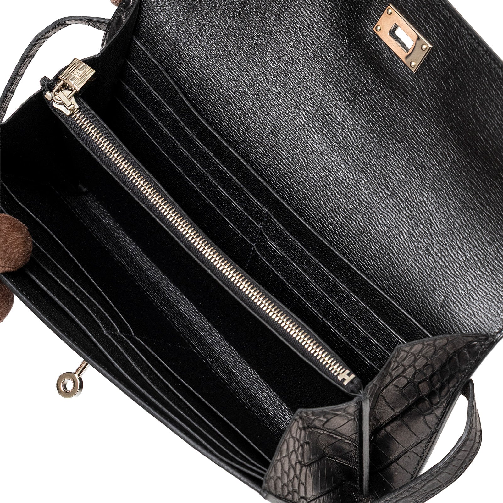 Interior close-up of Hermès Kelly Long Wallet Black Matte Alligator Palladium Hardware showing card slots and zippered compartment