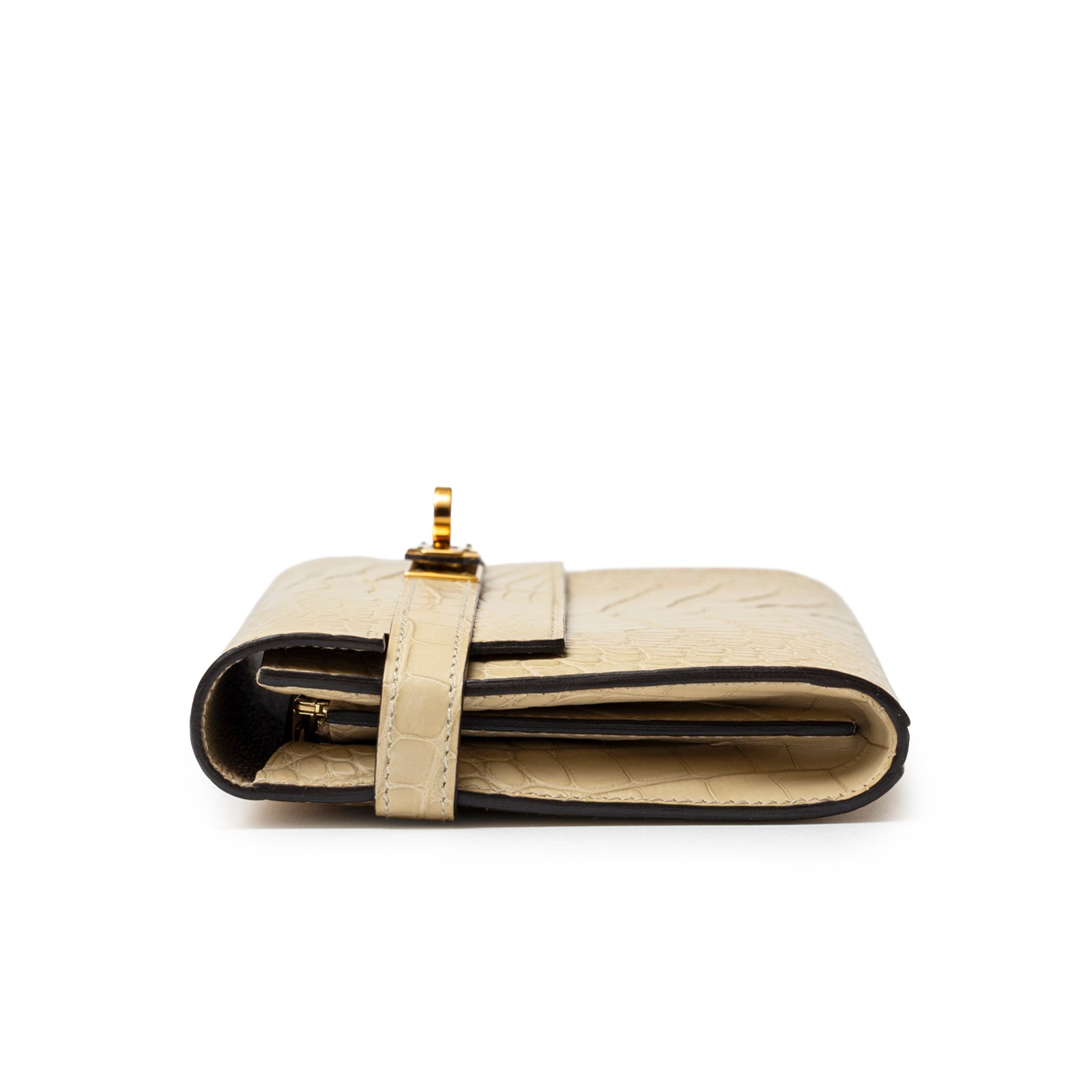 Side view of Hermès Kelly Long Wallet Vanille Matte Alligator Gold Hardware showing slim profile and strap closure