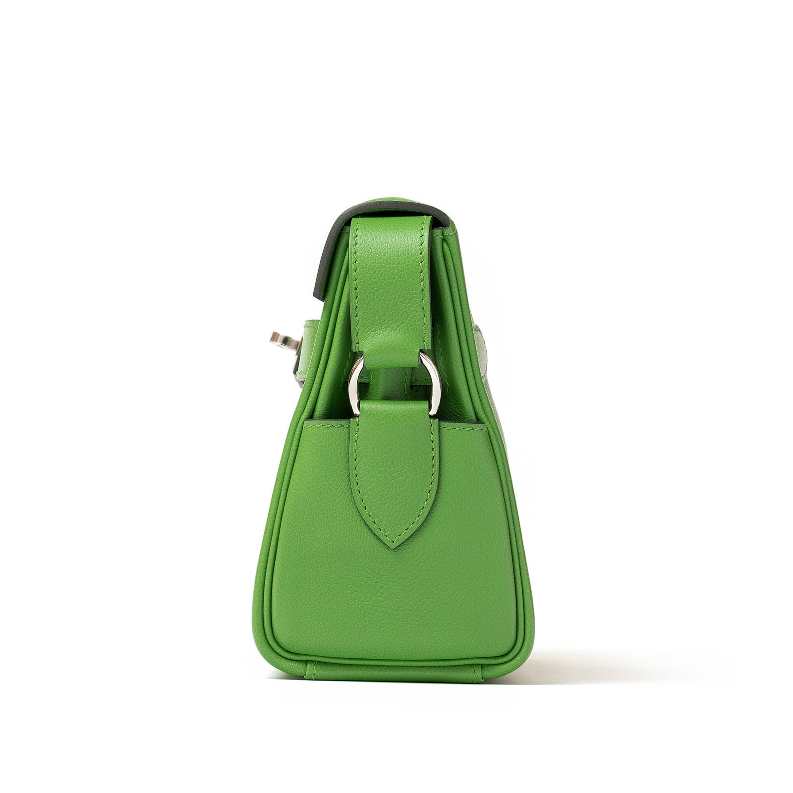 Side view of Hermès Kelly Messenger PM Vert Yucca Evercolor Palladium Hardware handbag with silver hardware against white background.