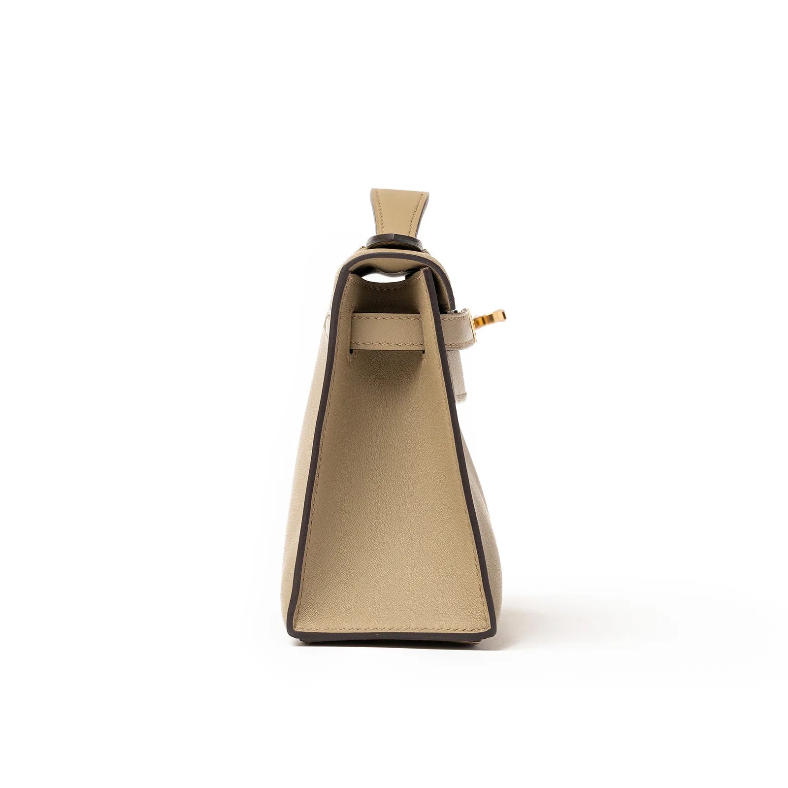 Side view of Hermès Kelly Pochette Beige Marfa Swift Gold Hardware showcasing its sleek silhouette and fine craftsmanship