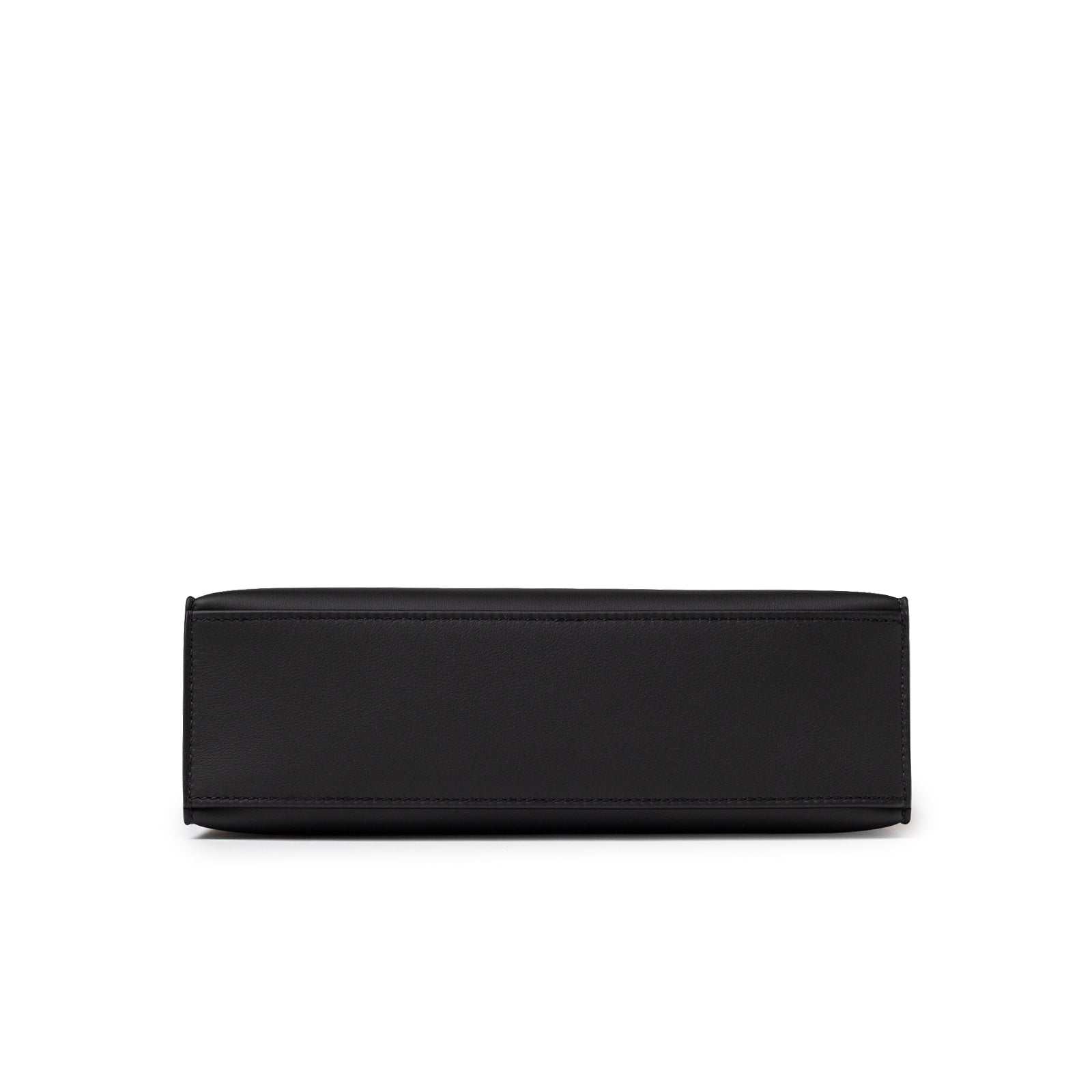 Bottom view showing smooth black leather base and precise stitching on Hermès Kelly Pochette Black Swift Palladium Hardware
