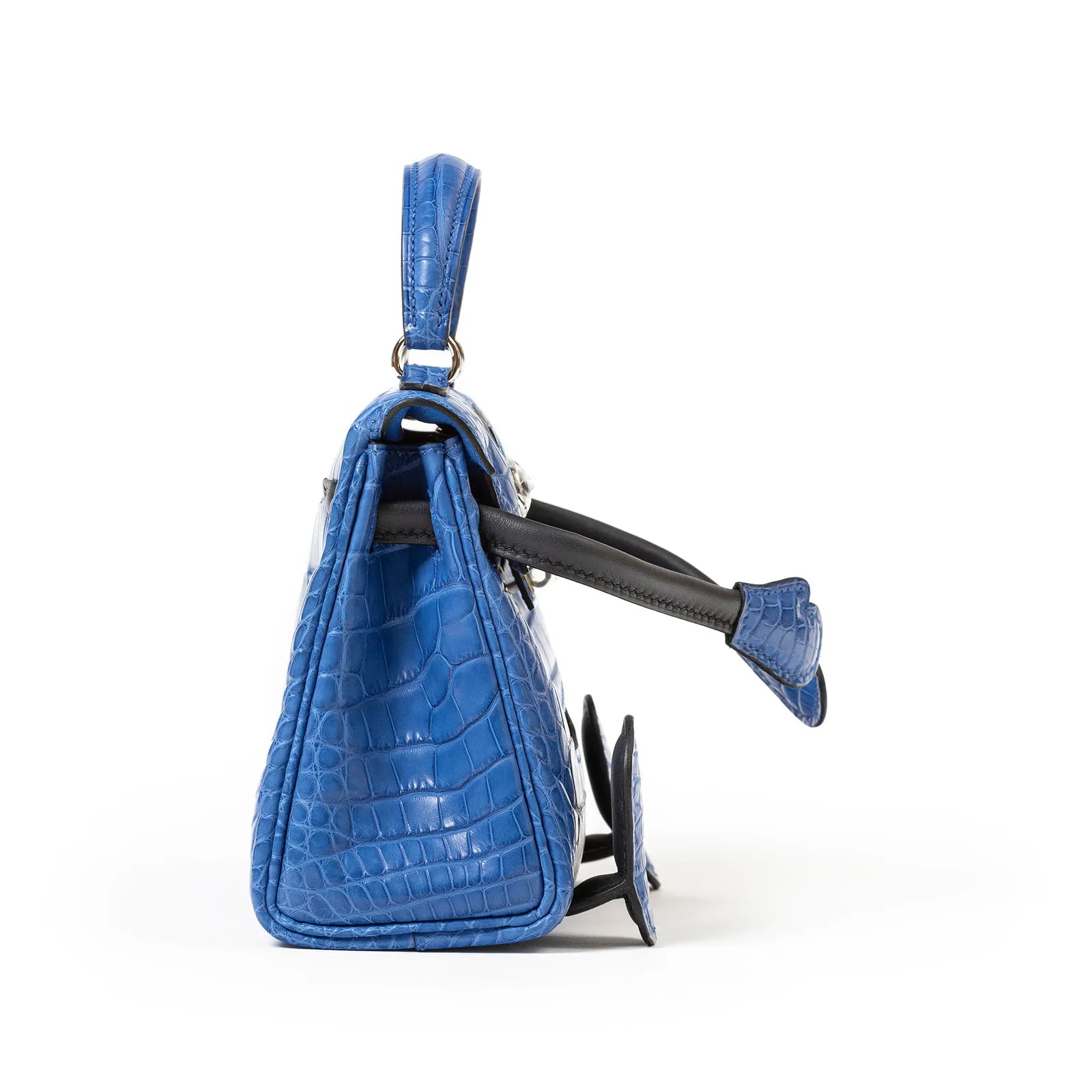Side view of Hermès Kelly Quelle Idole Doll Bag AB Bleu Zellige Bleu Indigo Palladium Hardware showing texture and strap details