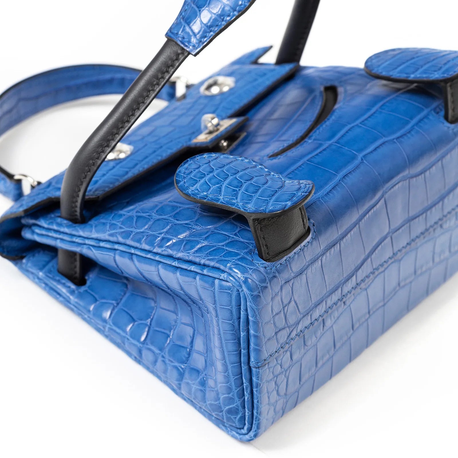 Close-up angled view of Hermès Kelly Quelle Idole Doll Bag AB Bleu Zellige/Bleu Indigo Palladium Hardware showing texture and stitching details