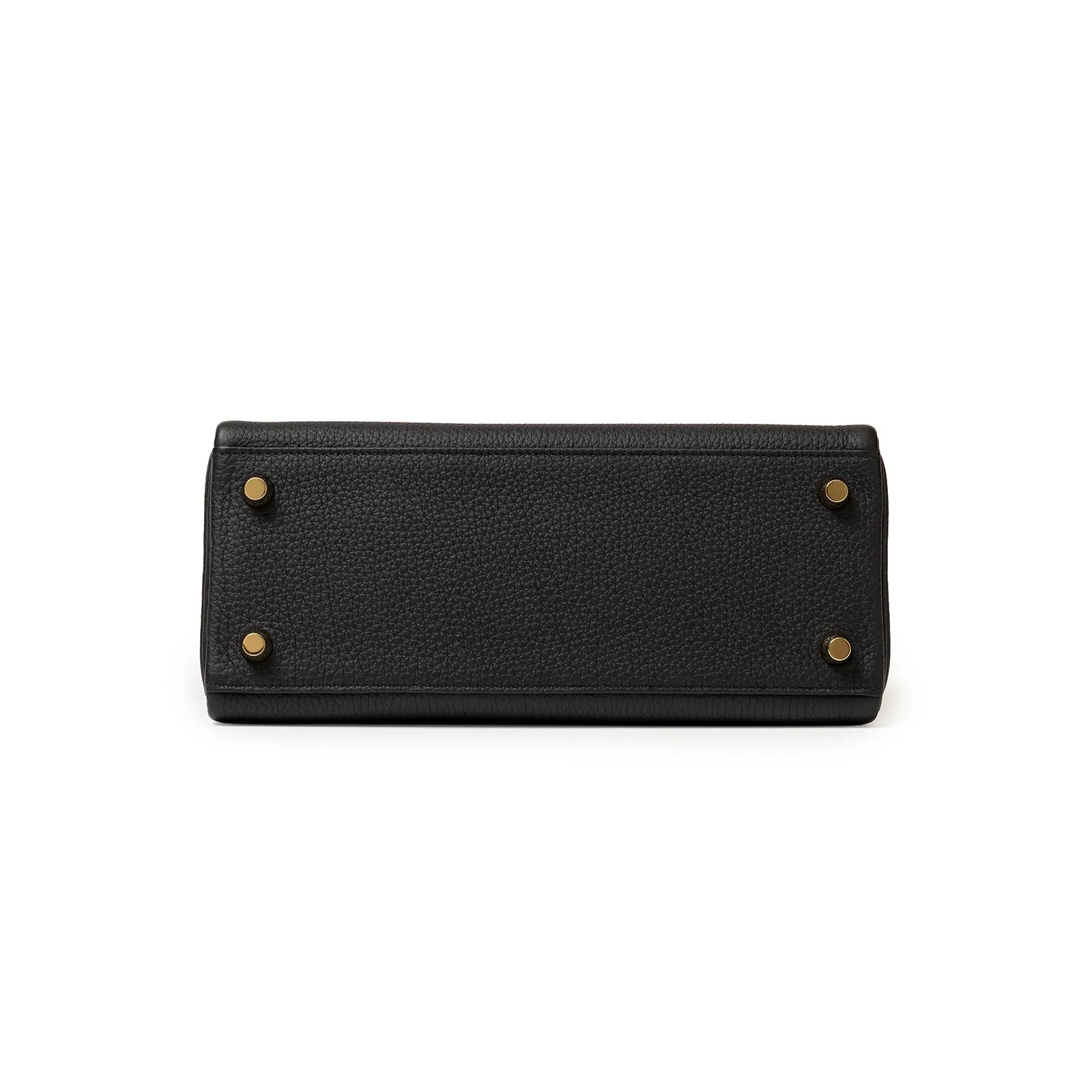 Bottom view of Hermès Kelly 25 Retourne Black Touch Togo/Lizard Permabrass Hardware bag with brass feet on a white background.