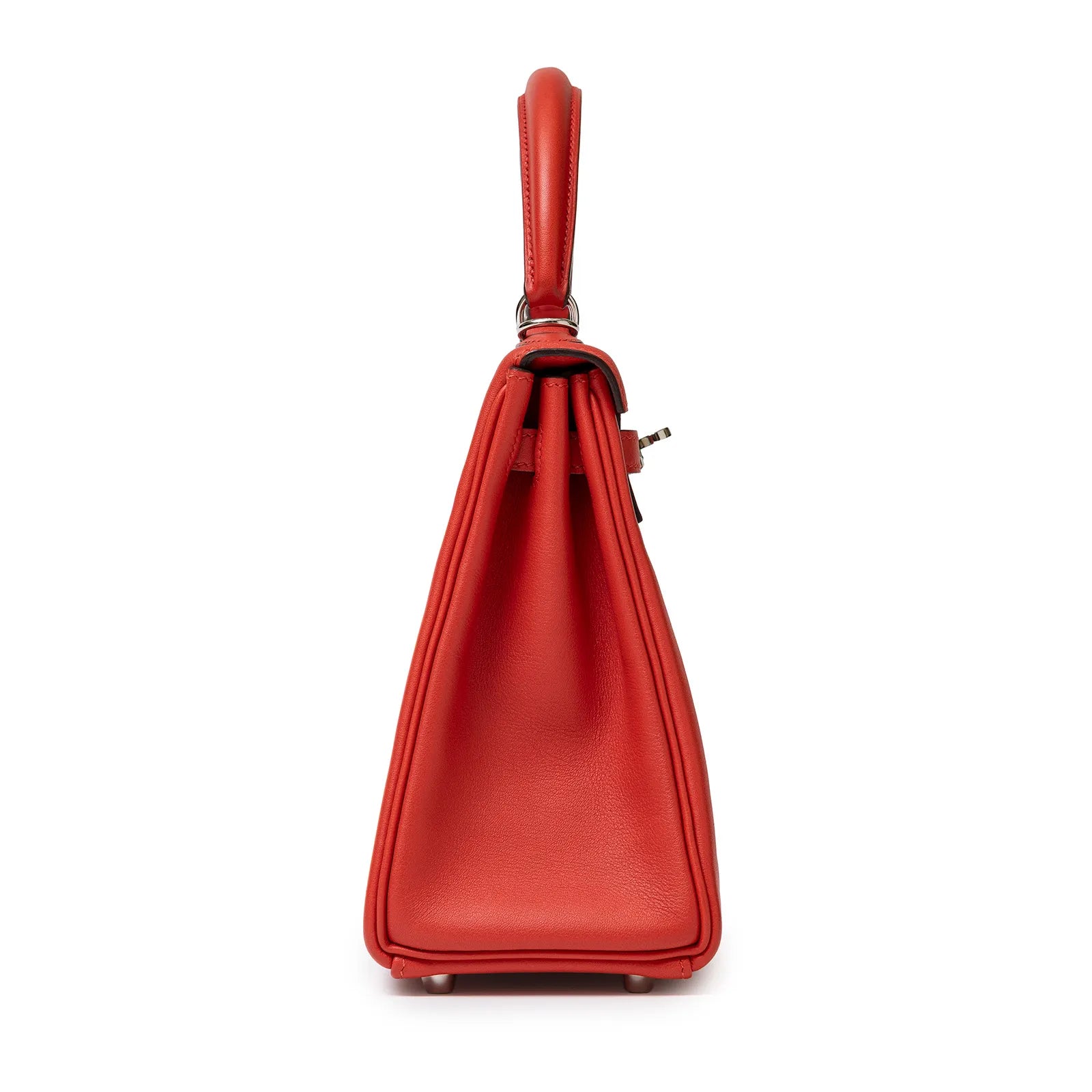 Side view of Hermès Kelly 25 Retourne Rouge Swift Palladium Hardware showing smooth red leather texture and handle detail