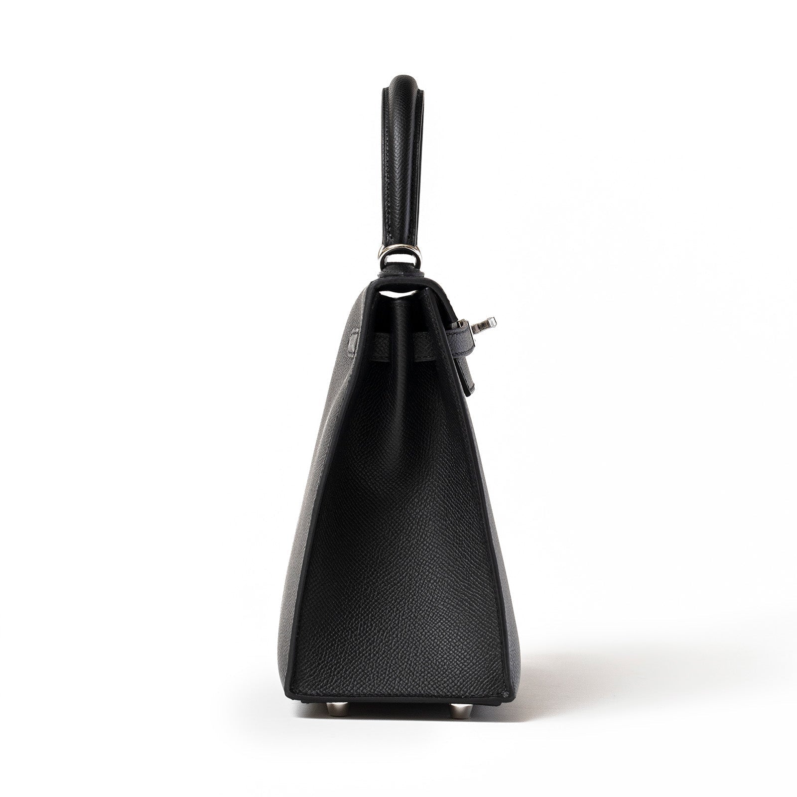Side profile of Hermès Kelly 25 Sellier Black Epsom Palladium Hardware showing leather texture and handle design