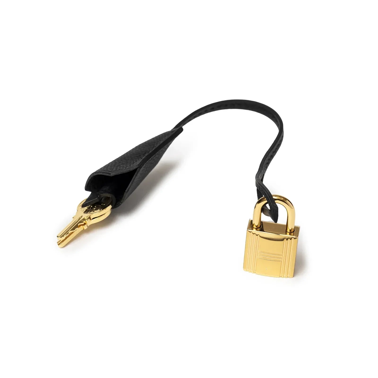 Close-up of gold lock and key with black leather strap for Hermès Kelly 28 Sellier Black Epsom Gold Hardware bag accessory
