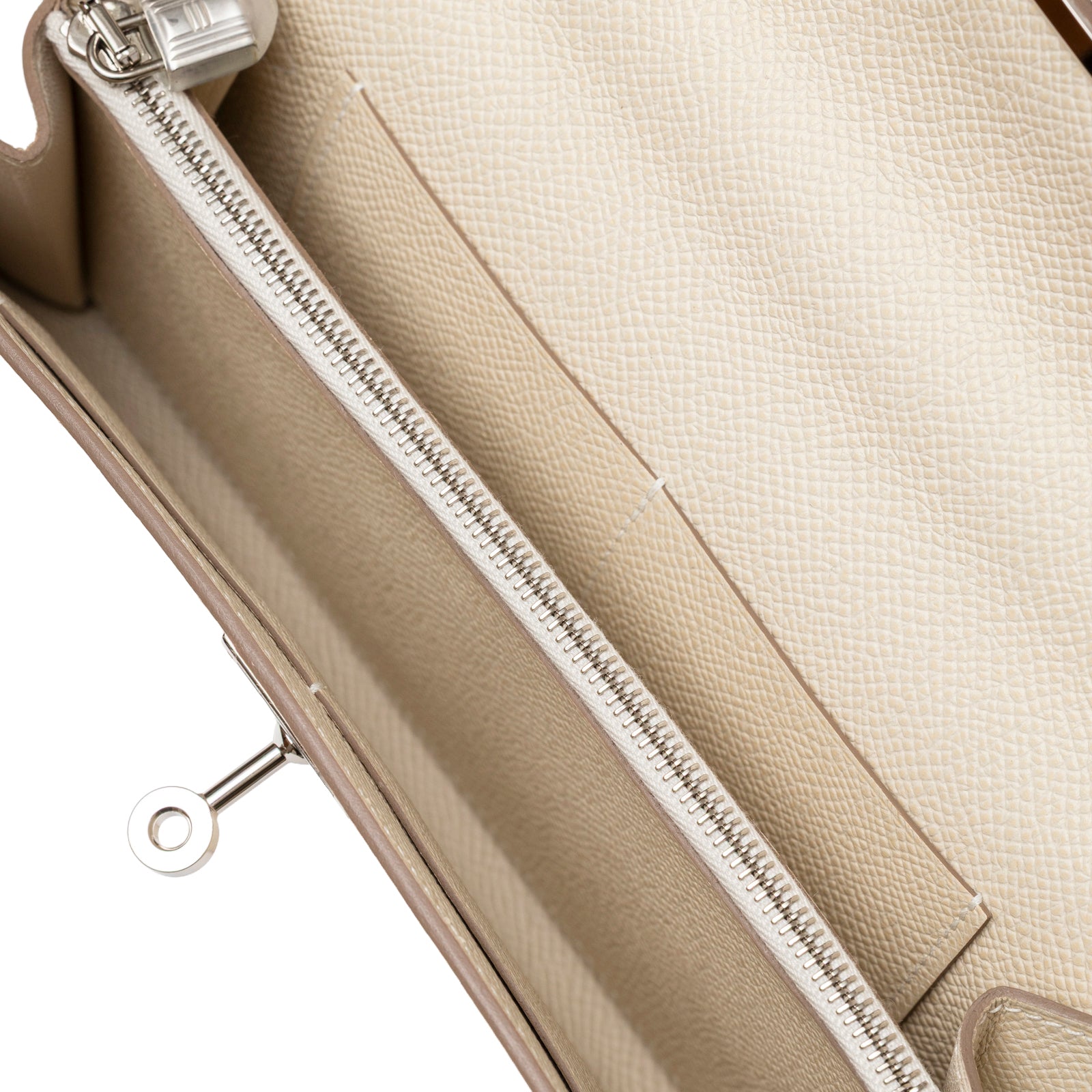 Close-up interior view of Hermès Kelly To Go Wallet Craie Epsom Palladium Hardware showing zipper and card slot details
