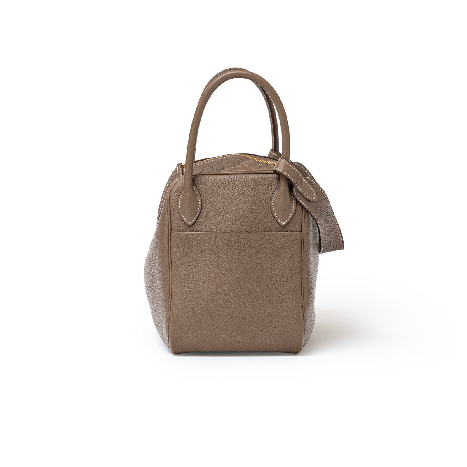 Side view of Hermès Lindy 30 Etoupe Clemence Gold Hardware handbag showing textured leather and handles detail