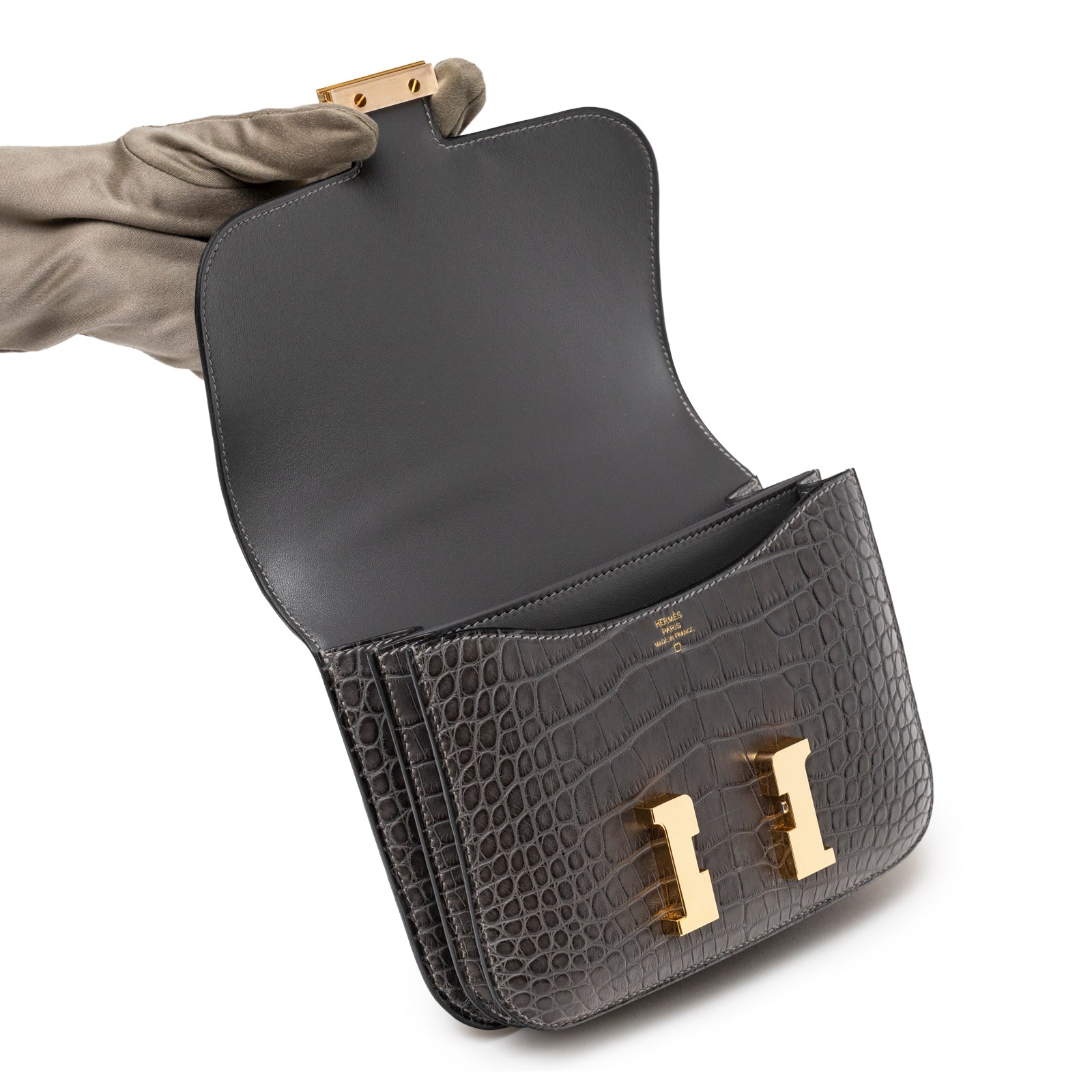 Open view of Hermès Mini Constance 18 Graphite Matte Alligator Gold Hardware showing interior and clasp detail