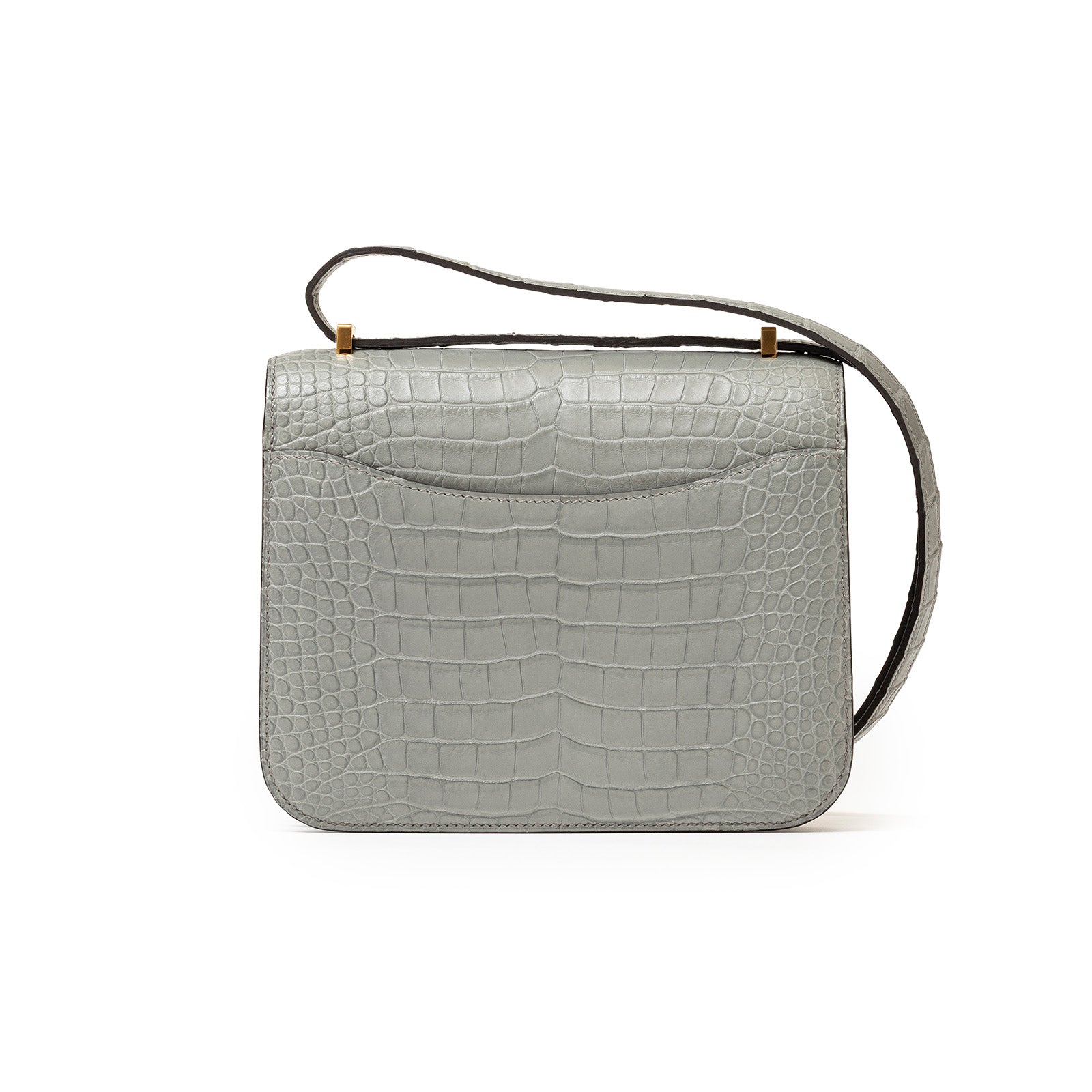 Back view of Hermès Mini Constance 18 Gris Ciment Matte Alligator Gold Hardware with shoulder strap visible