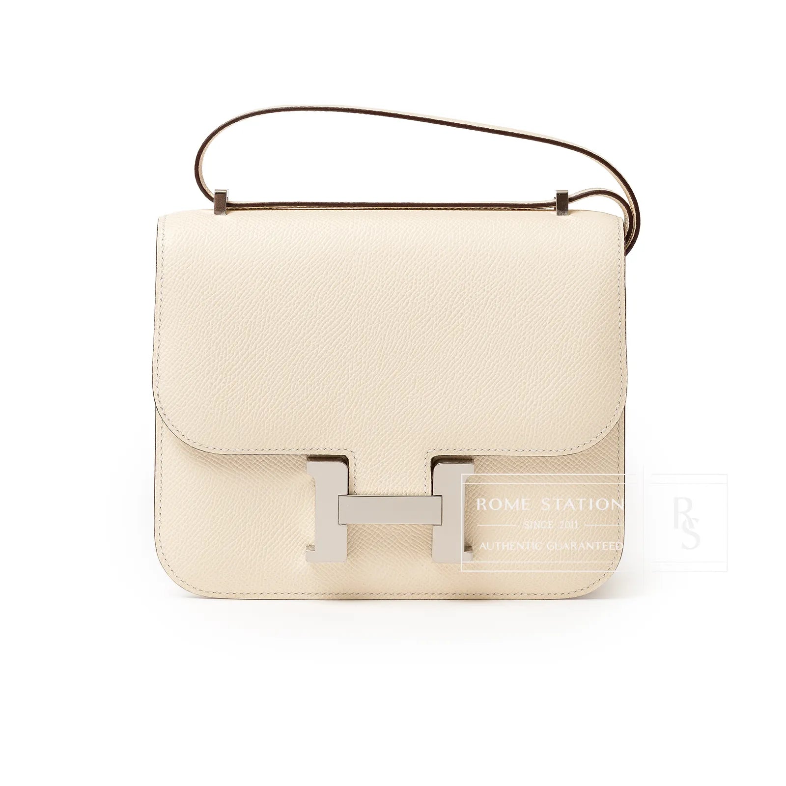 Front view of Hermès Mini Constance 18 Nata Epsom Palladium Hardware with smooth leather and silver clasp detail