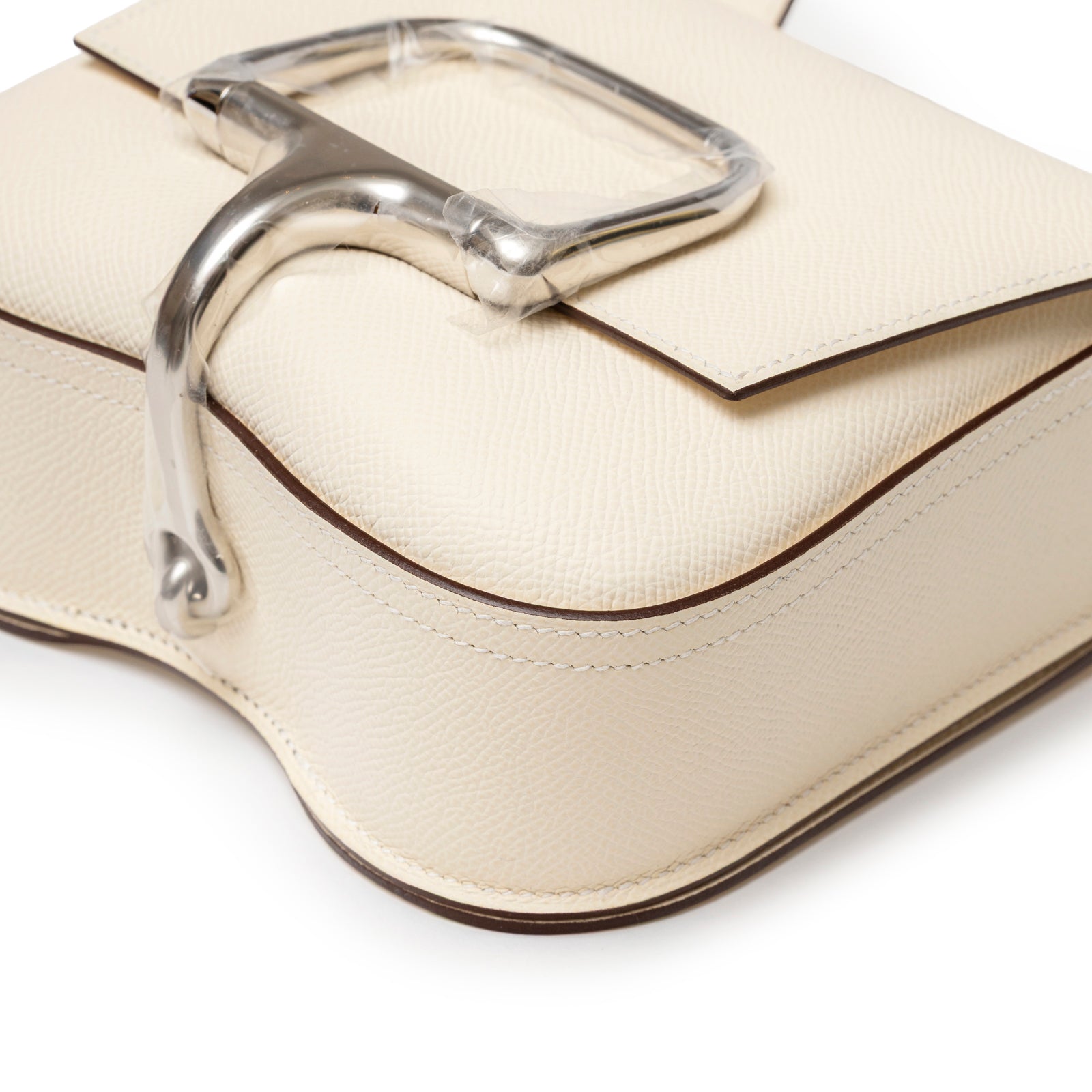 Close-up angled view of Hermès Mini Della Cavalleria Craie Epsom Palladium Hardware showing flap and silver clasp detail