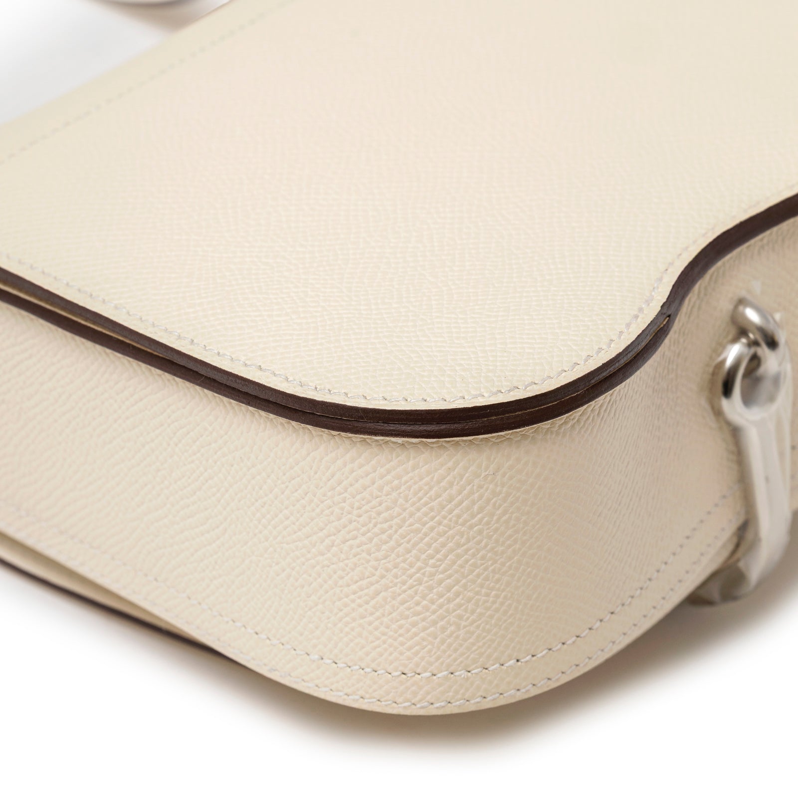 Close-up of Hermès Mini Della Cavalleria Craie Epsom Palladium Hardware showing cream textured leather and edge detail