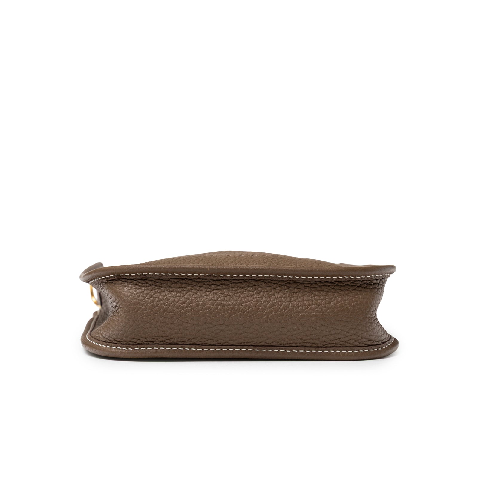 Bottom view of Hermès Mini Evelyne Etoupe Blue Indigo Clemence Gold Hardware showing pebbled leather texture and white stitching detail