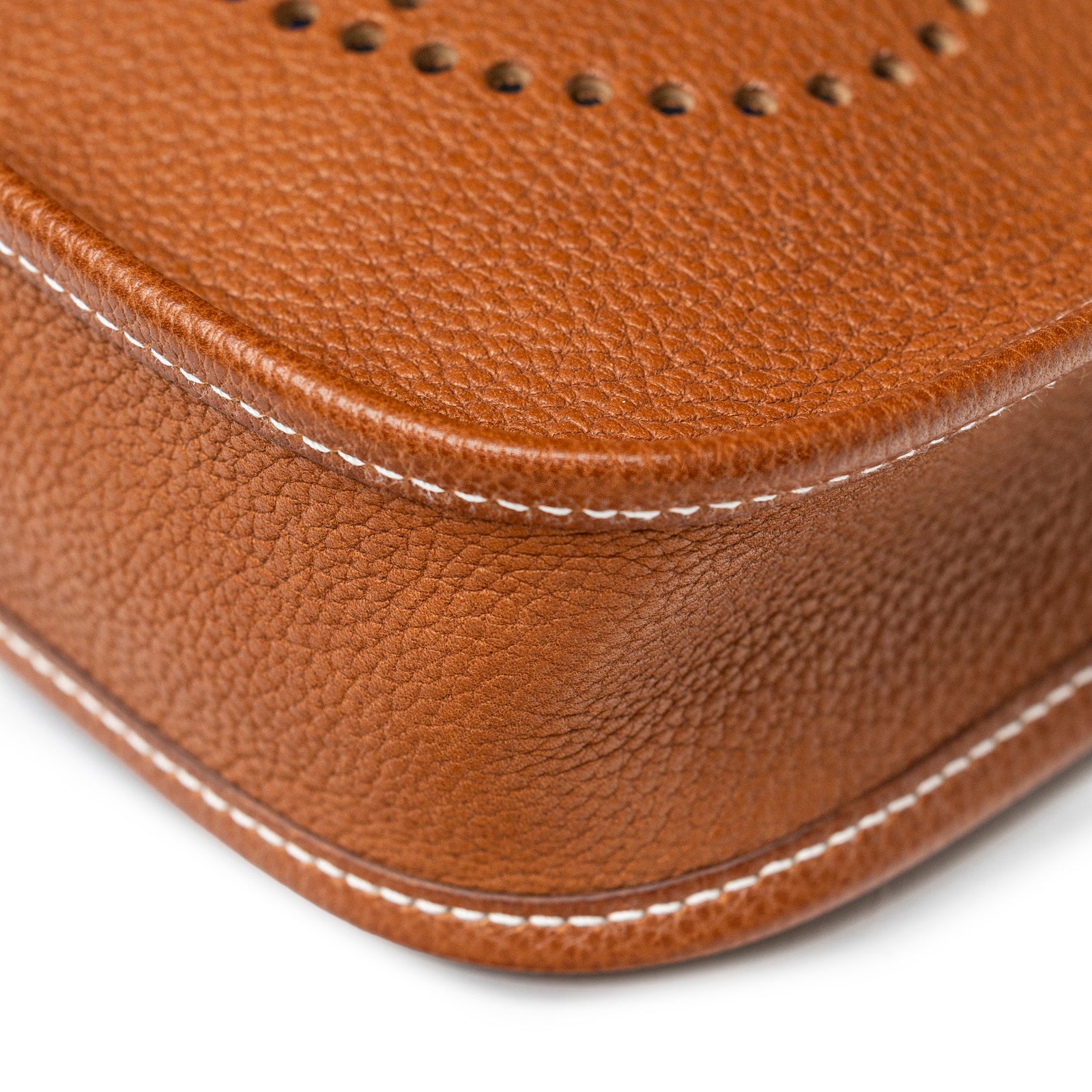Close-up of Hermès Mini Evelyne Fauve Barenia Palladium Hardware corner showing detailed grain leather and stitching