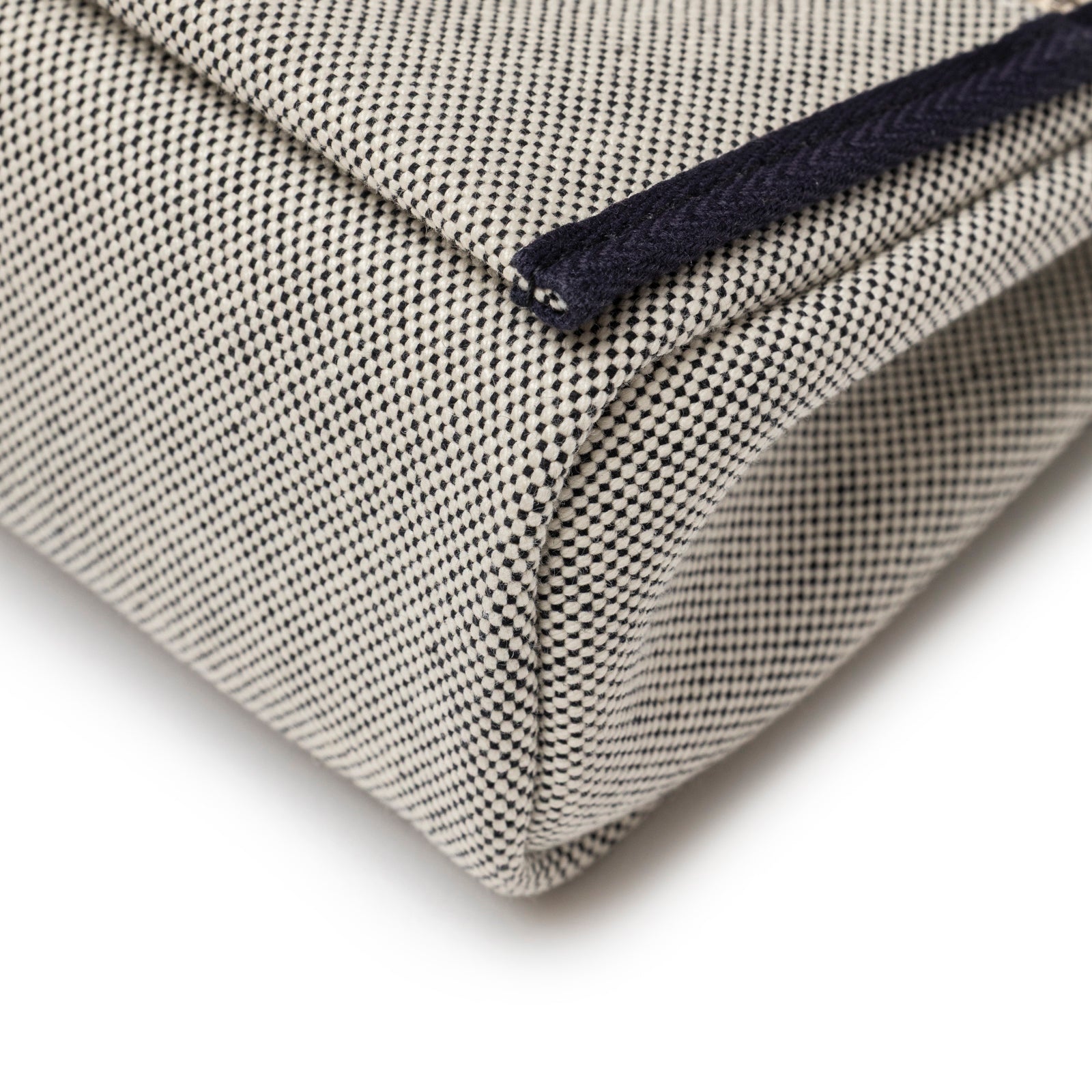 Close-up of corner detail showcasing the toile fabric and navy trim of Hermès Mini Herbag Zip 20 Ecru-Black Blue Indigo Toile and Vache Hunter Palladium Hardware