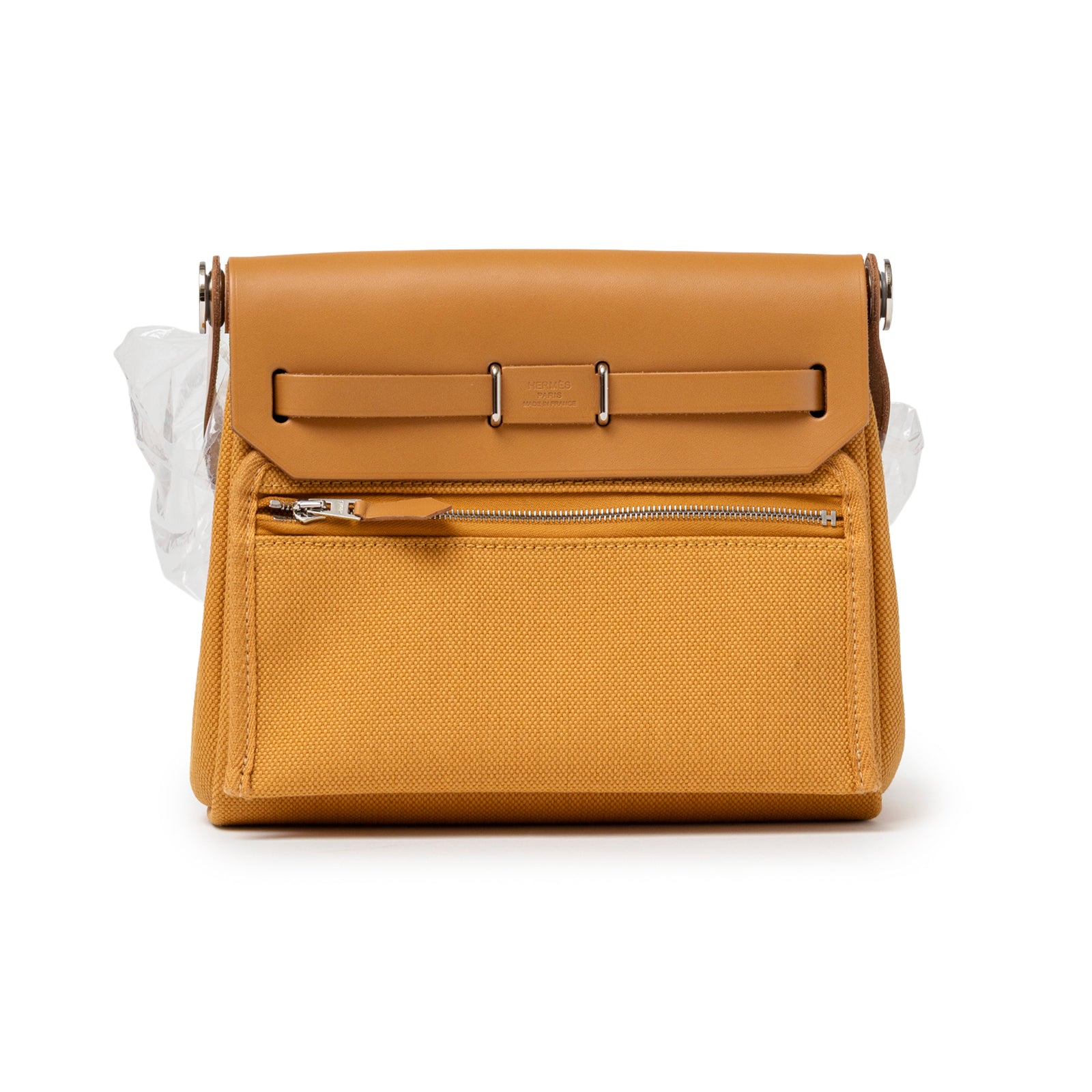 Back view of Hermès Mini Herbag Zip 20 Naturel Sable Toile and Vache Hunter Palladium Hardware with zipped pocket detail