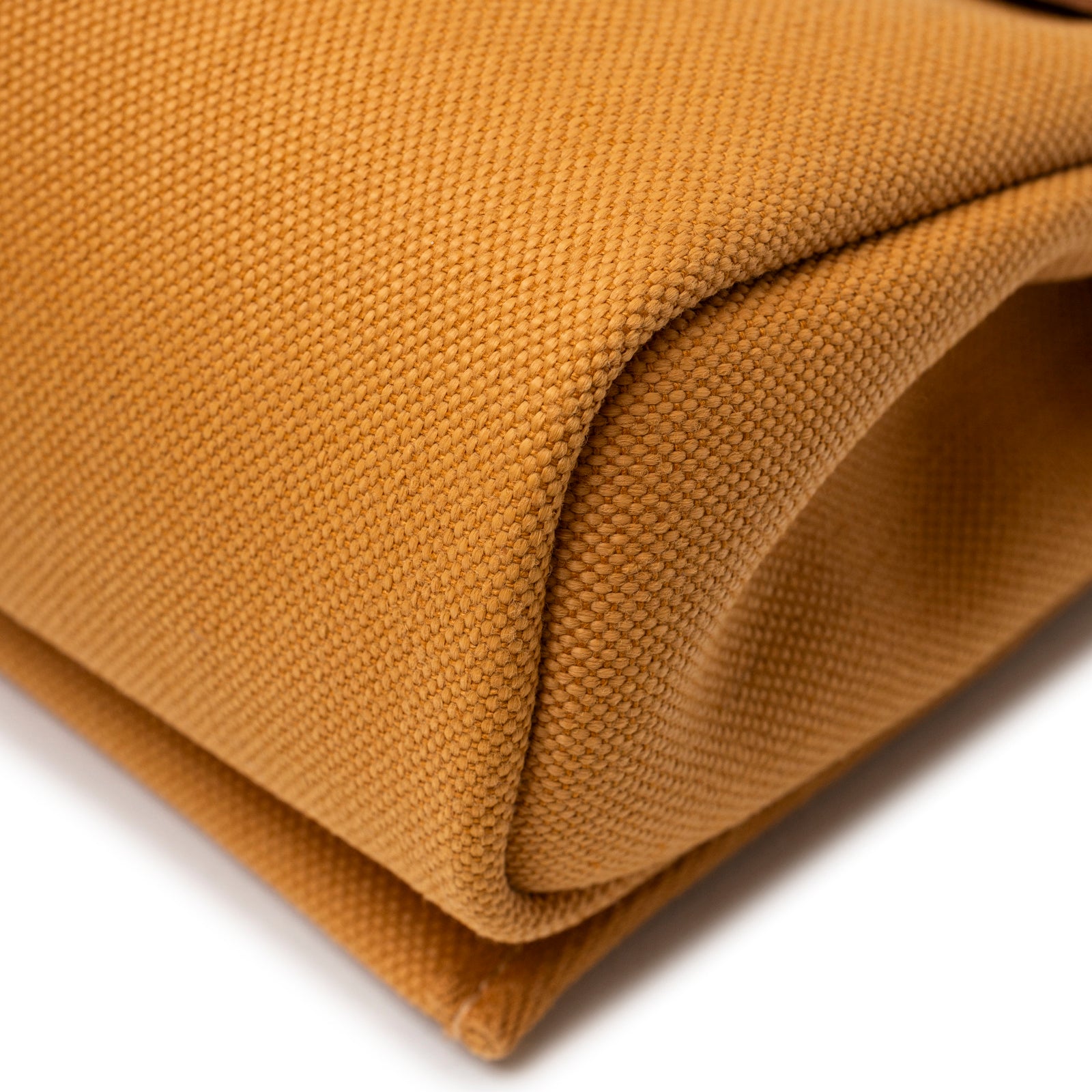 Close-up of textured canvas corner on Hermès Mini Herbag Zip 20 Naturel Sable Toile and Vache Hunter Palladium Hardware