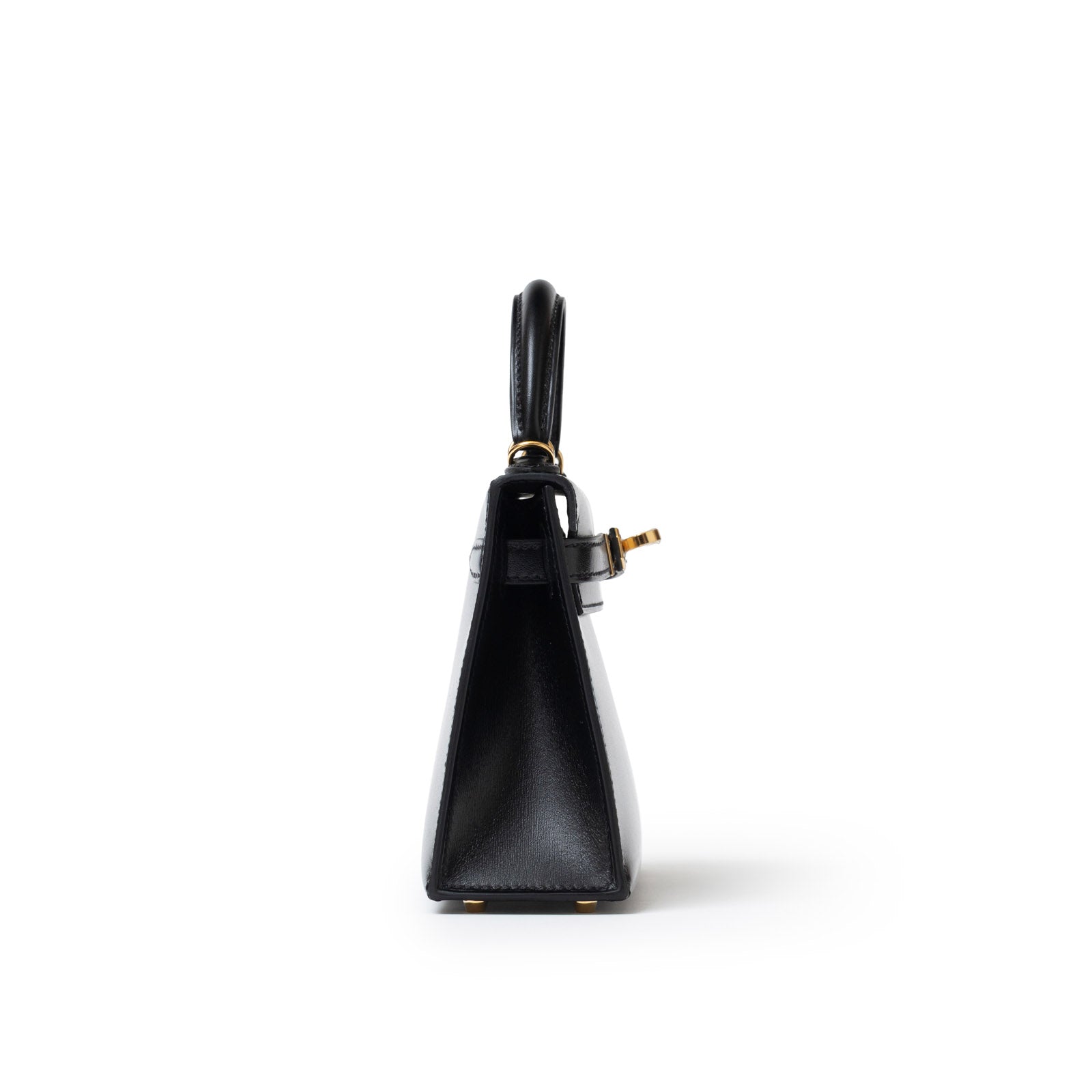 Side view of Hermès Mini Kelly II Sellier 20 Black Box Gold Hardware showing leather texture and top handle details