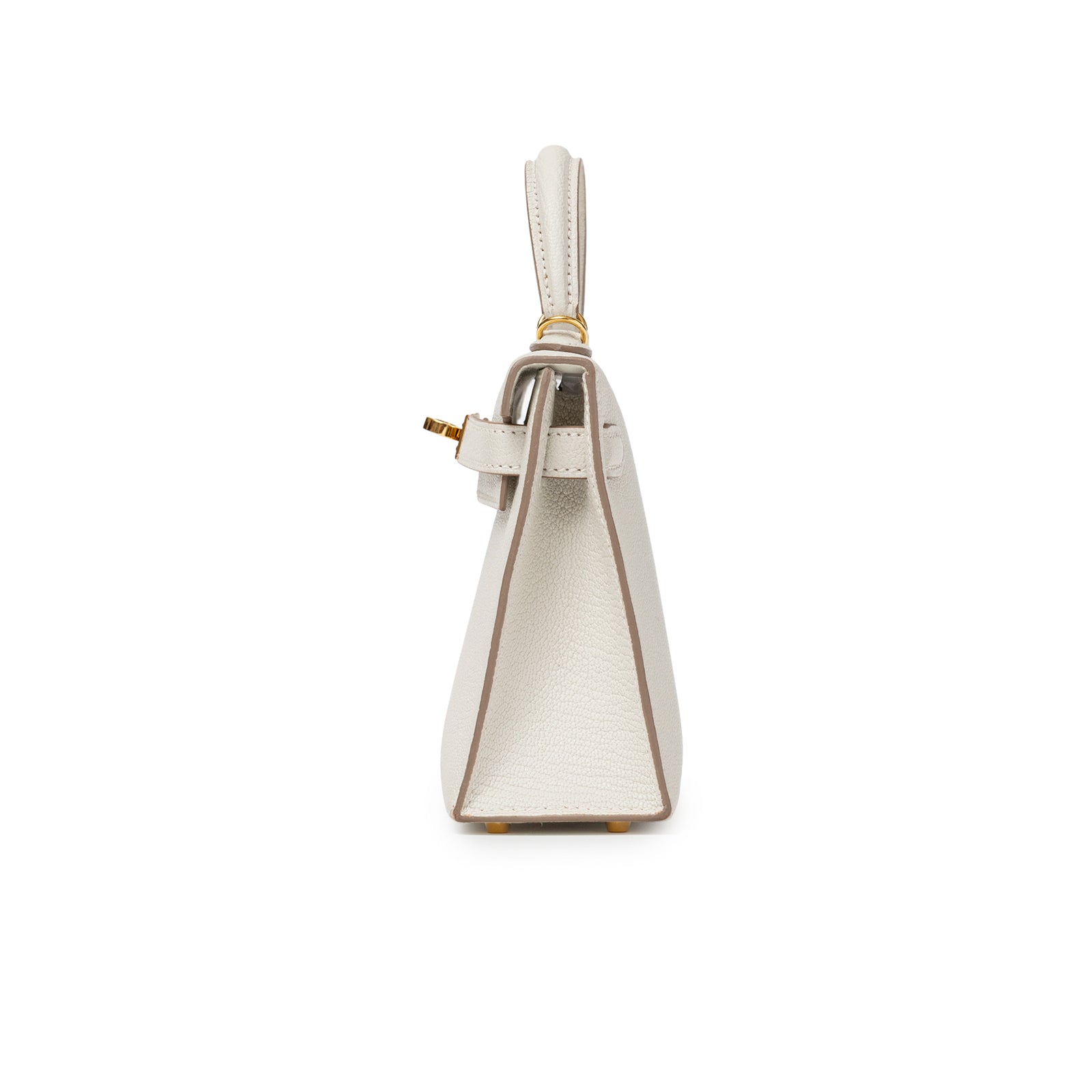 Side profile of Hermès Mini Kelly II Sellier Mushroom Chevre Mysore Gold Hardware showing structured leather and gold feet detail