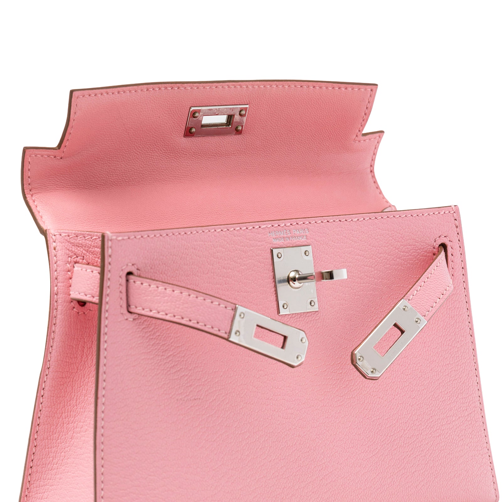 Open top view of Hermès Mini Kelly II Sellier Rose Confetti Chevre Mysore Palladium Hardware showing interior edge and clasp details
