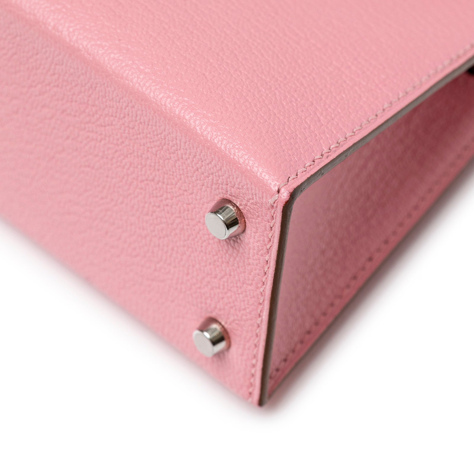 Close-up angled shot of Hermès Mini Kelly II Sellier Rose Confetti Chevre Mysore Palladium Hardware corner detail