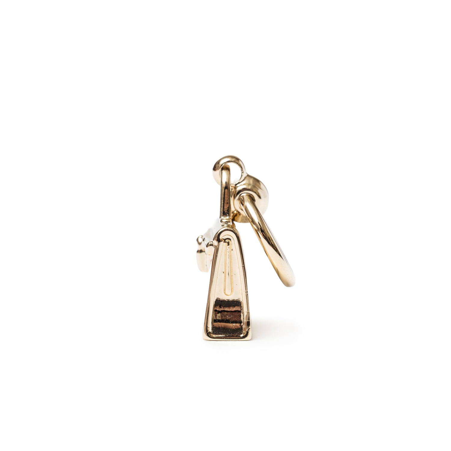 Side view of Hermès Mini Kelly Twilly Ring Permabrass Plated showing polished brass and ring attachment details