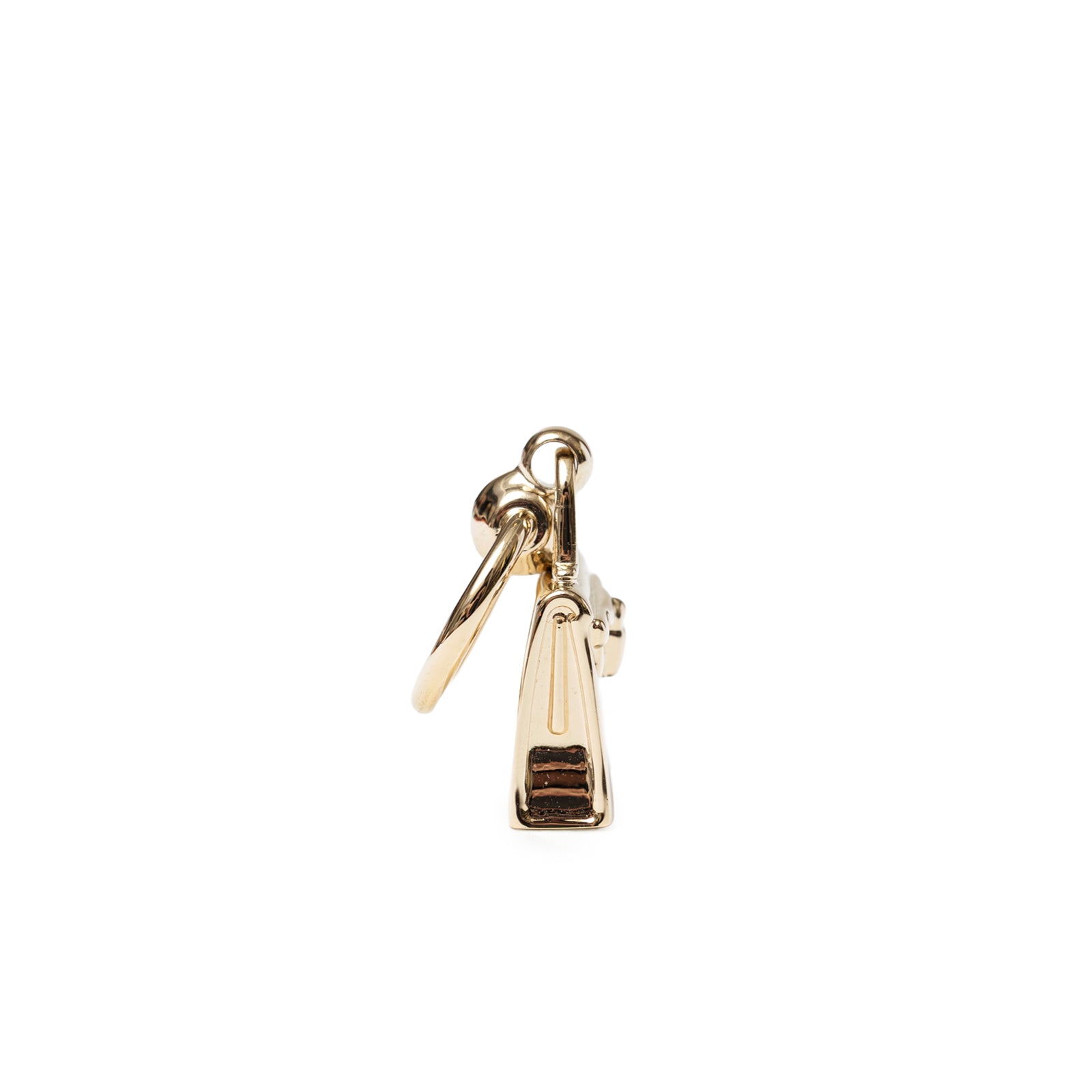 Close-up side view of Hermès Mini Kelly Twilly Ring Permabrass Plated highlighting polished metal and clasp details