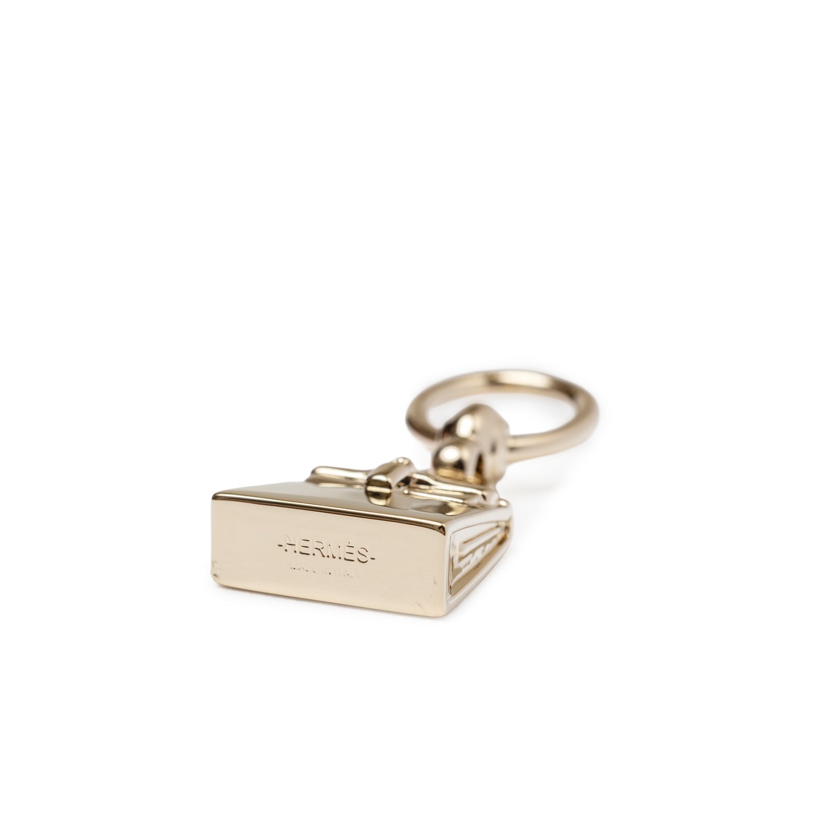 Bottom view of Hermès Mini Kelly Twilly Ring Palladium Plated showcasing its polished metallic detail and signature clasp design.
