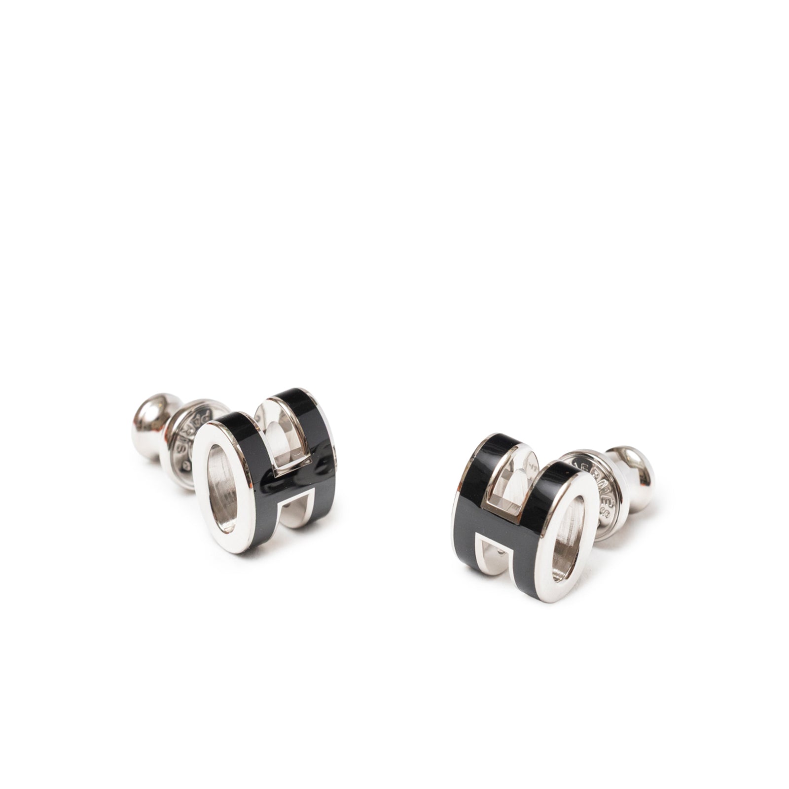 Close-up front view of Hermès Mini Pop H Earrings Black Palladium Plated with black enamel detailing and polished finish.