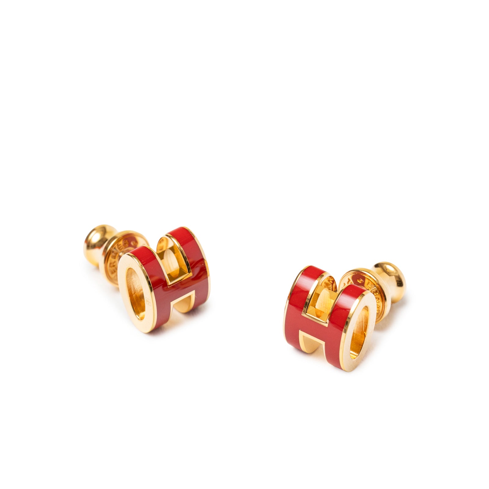 Close-up front angled view of Hermès Mini Pop H Earrings Red Gold Plated with vibrant red enamel accents.