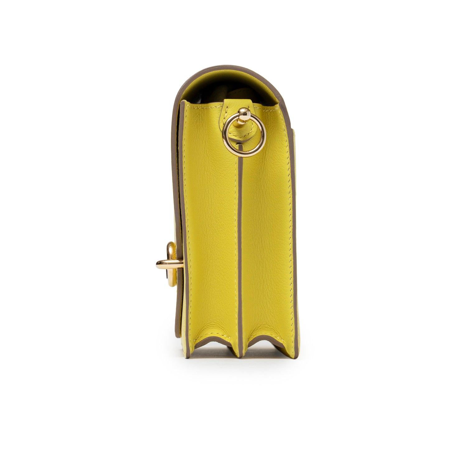 Side view of Hermès Mini Roulis Lime Evercolor Permabrass Hardware showing leather texture and strap ring detail