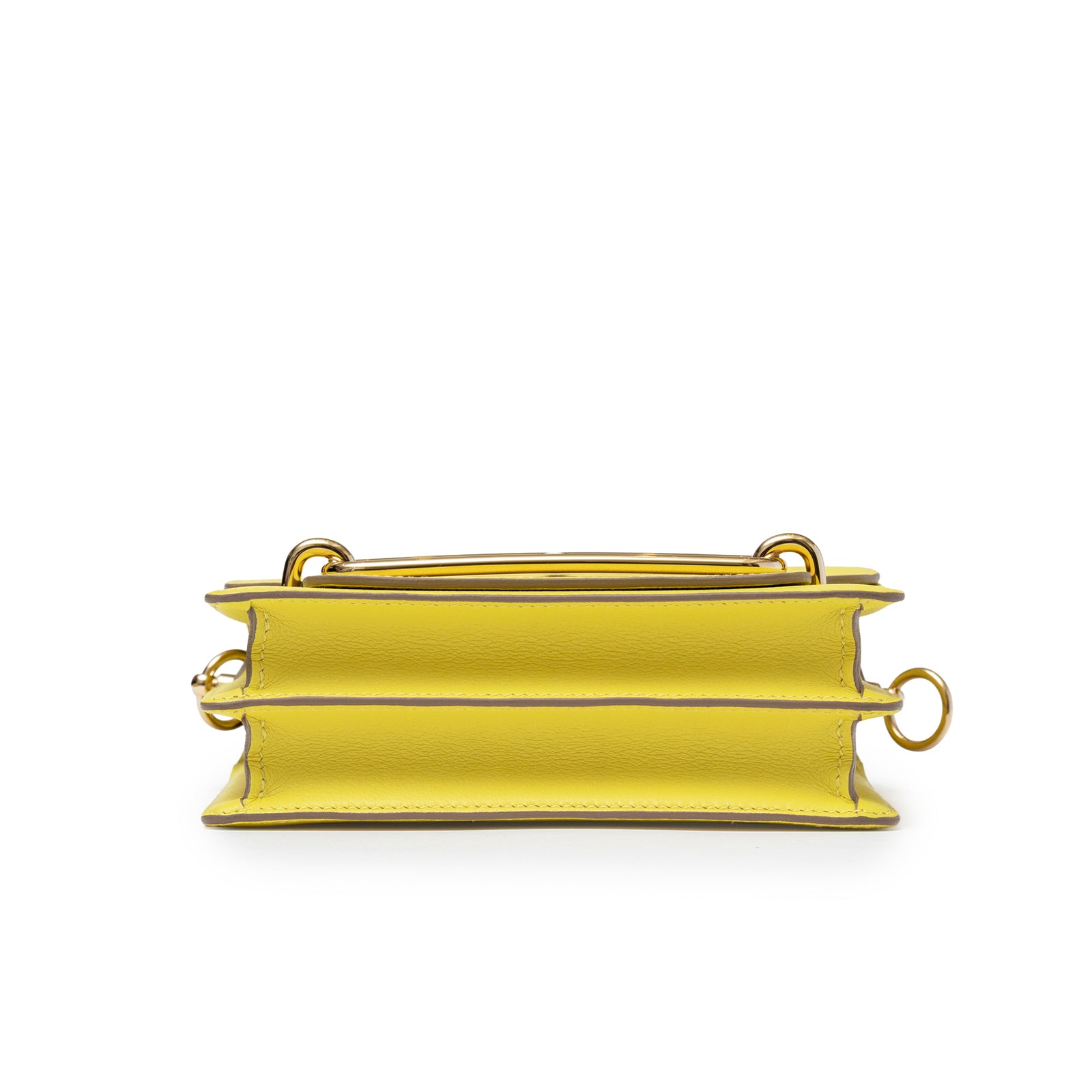Bottom view of Hermès Mini Roulis Lime Evercolor Permabrass Hardware showing structured leather and gold hardware details