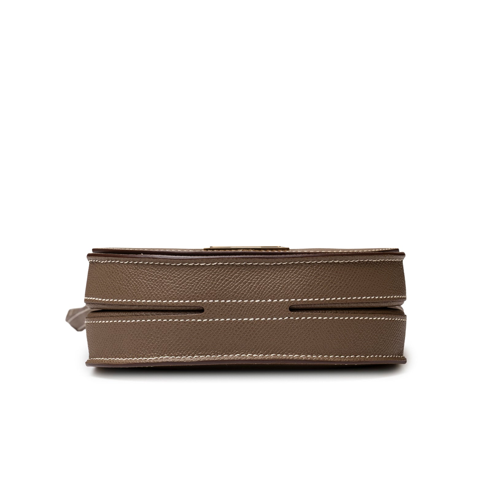 Bottom view of Hermès Mosaique Au 24-17 Etoupe Epsom Permabrass Hardware showing structured base and stitching detail