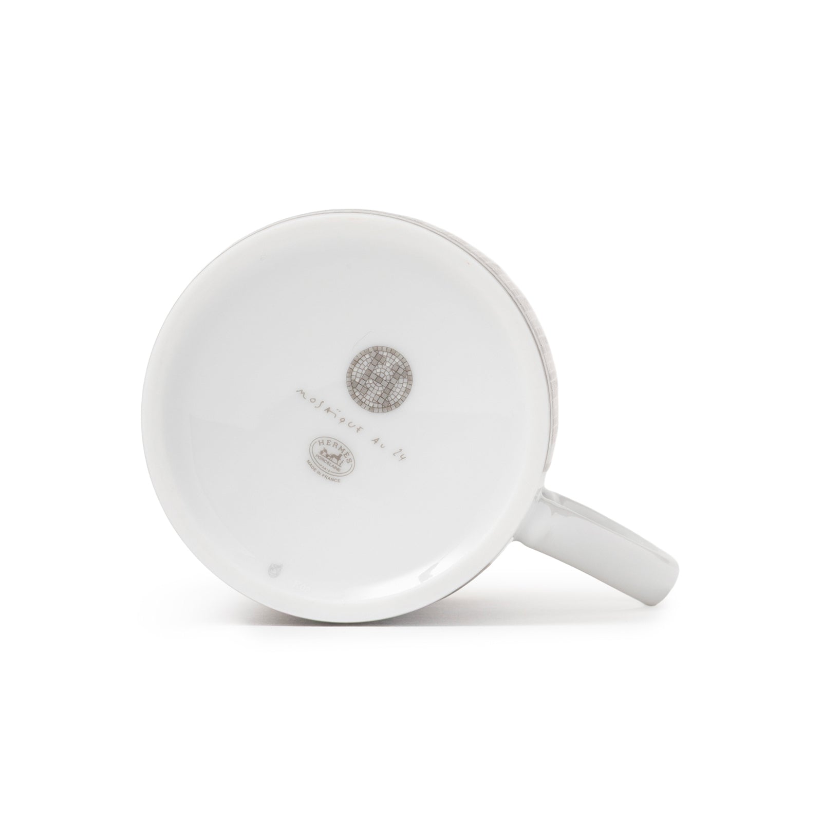 Bottom view of Hermès Mosaique au 24 Platinum Mug showing porcelain markings and handle detail