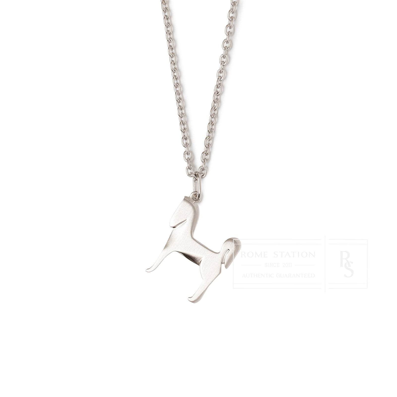 Close-up front view of Hermès Panache Necklace Brushed Palladium with horse-shaped pendant on chain