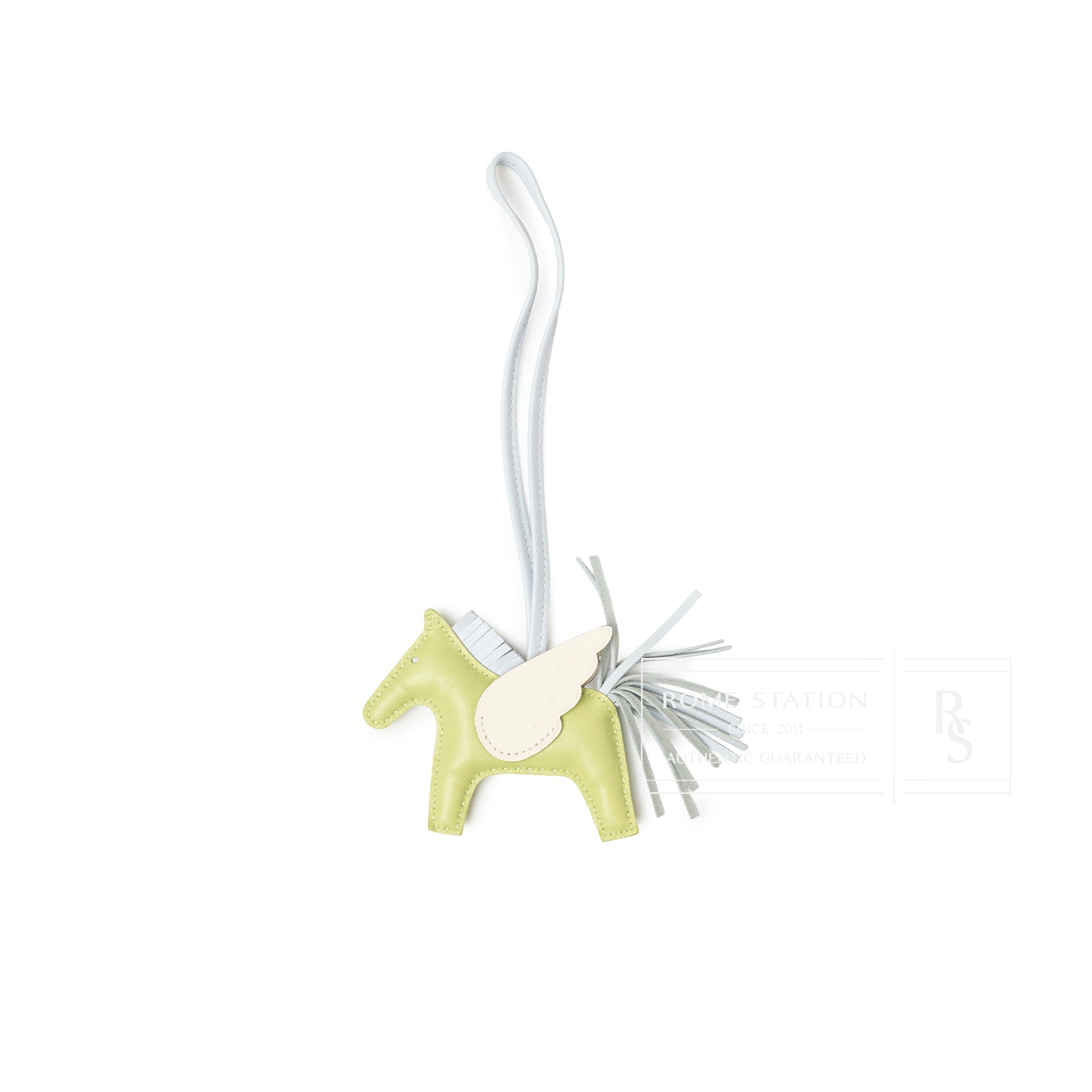 Top-down view of Hermès Pegase Rodeo Bag Charm PM Jaune Bourgeon/Craie/Blue Brume Milo Lambskin with wing detail