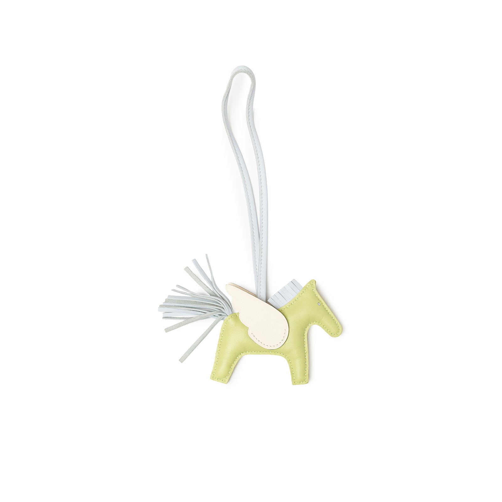 Angled view of Hermès Pegase Rodeo Bag Charm PM Jaune Bourgeon/Craie/Blue Brume Milo Lambskin horse shape with tassel tail