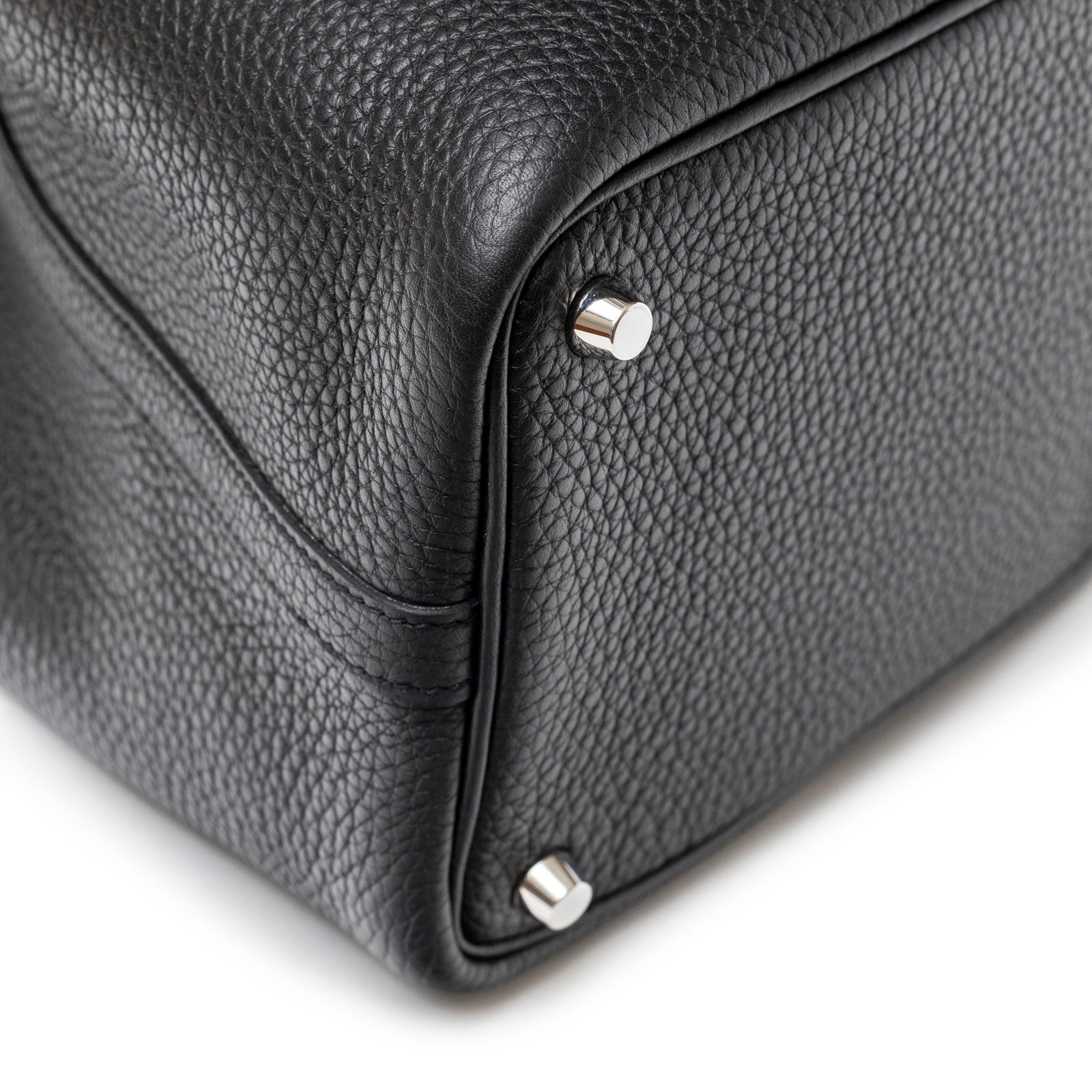 Close-up of bottom corner showing textured leather and palladium hardware on Hermès Picotin 18 Black Clemence Palladium Hardware