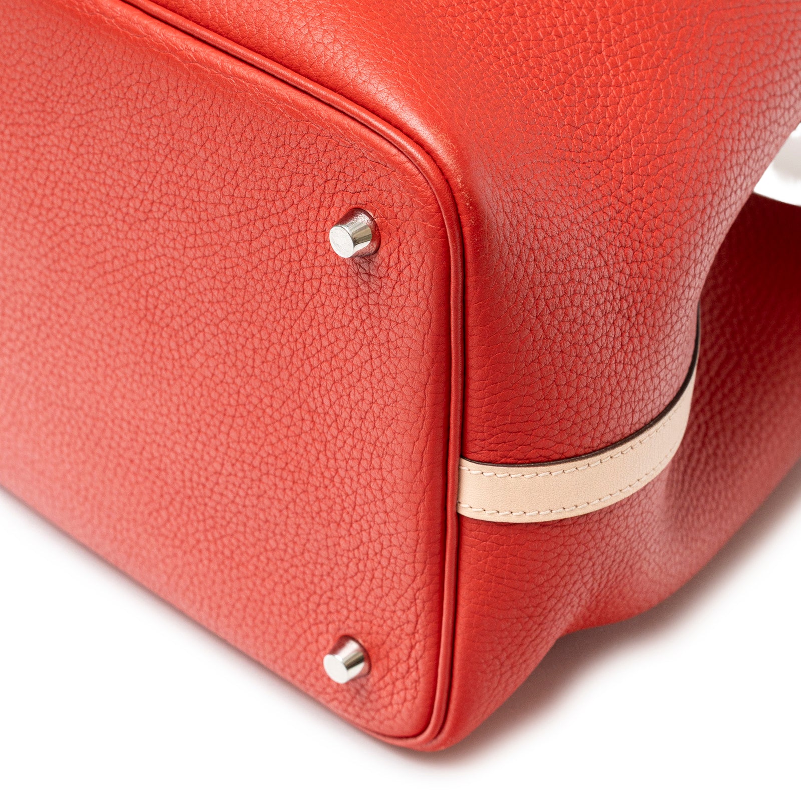 Close-up of Hermès Picotin 22 Rouge Tomate Rose Elegante Clemence Palladium Hardware corner and base studs angle
