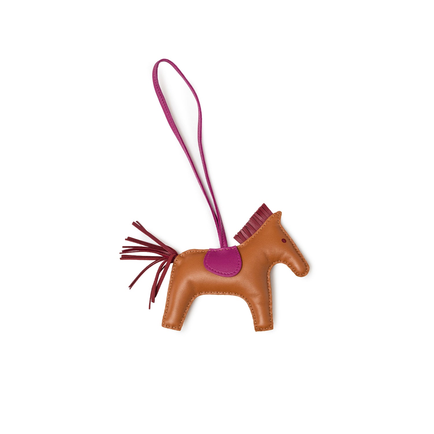 Angled view of Hermès Rodeo Bag Charm MM Gold/Rubis/Rose Pourpre Milo Lambskin horse shape with detailed stitching
