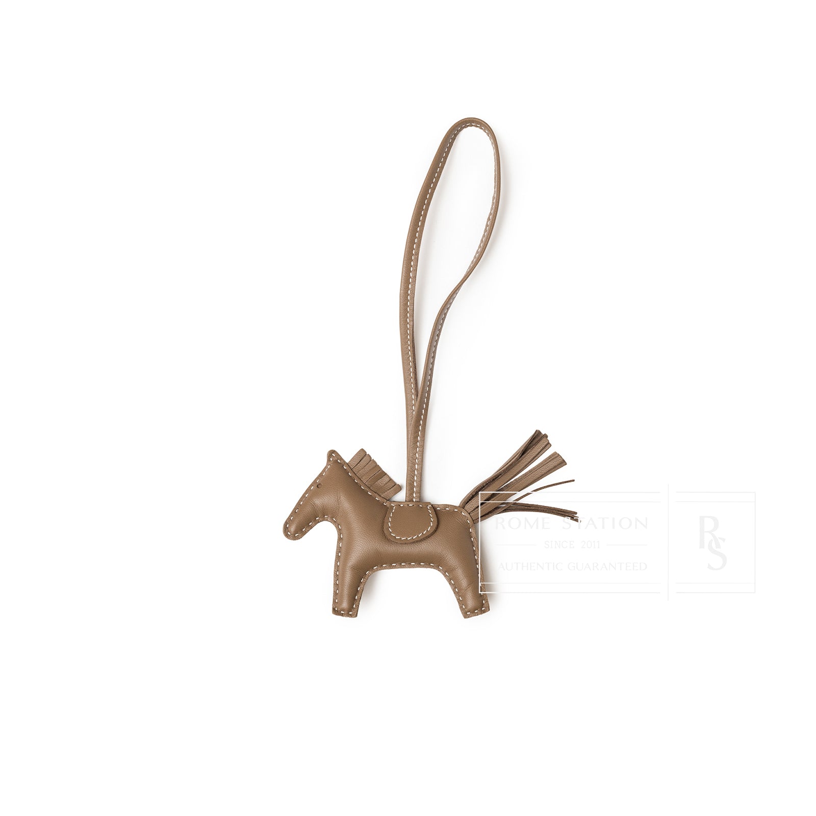 Front view of Hermès Rodeo PM Etoupe Milo Lambskin horse-shaped charm with stitched details and leather tail