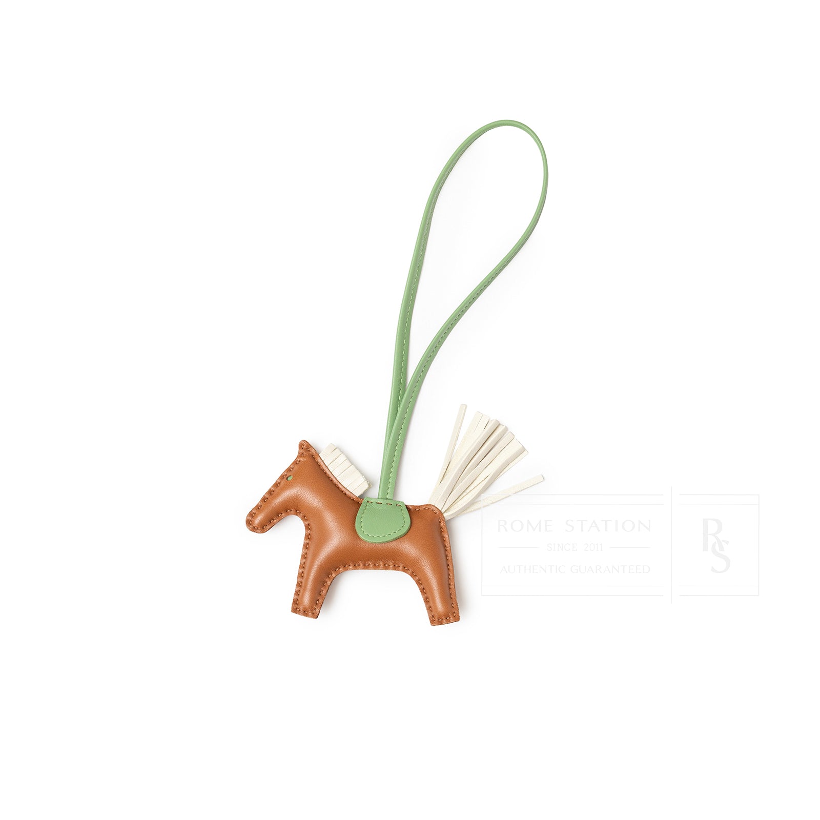 Top view of Hermès Rodeo PM Gold/Craie/Vert Criquet leather charm showing stitched horse shape and long loop strap