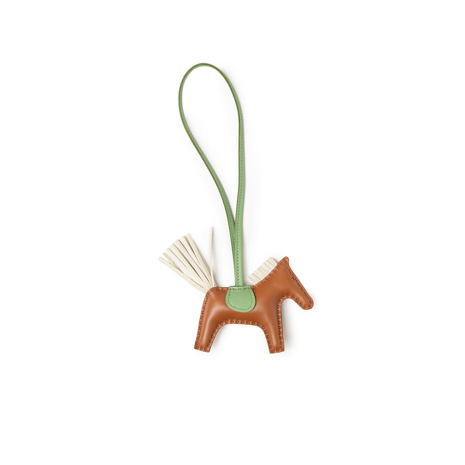Top view of Hermès Rodeo PM Gold/Craie/Vert Criquet leather horse charm with green strap and cream tail