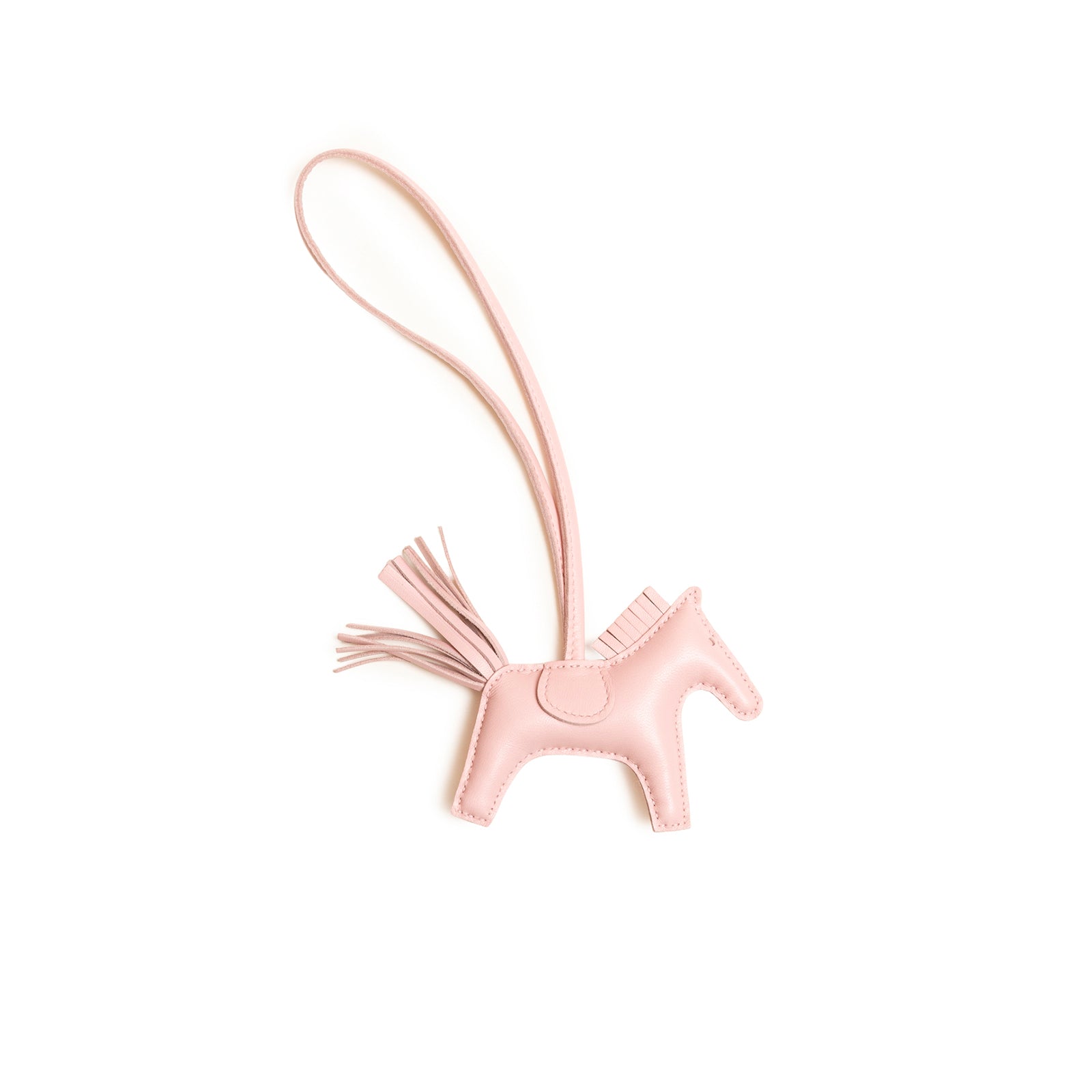 Top view of Hermès Rodeo PM Rose Sakura Milo Lambskin horse bag charm with leather tail and strap detail