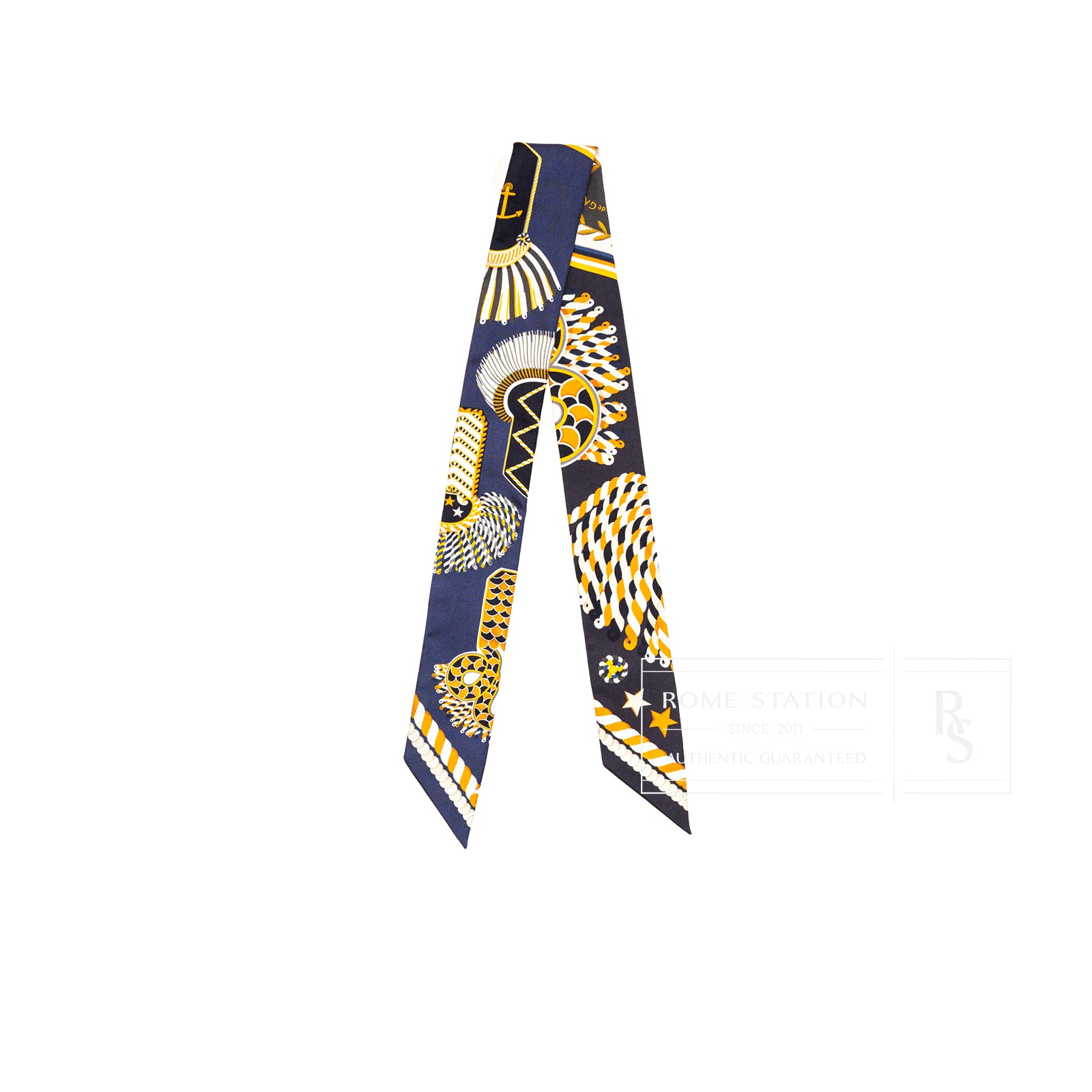 Front view of Hermès Twilly Epaulettes De Gala Marine Gold Blanc with navy, gold, and white intricate patterns